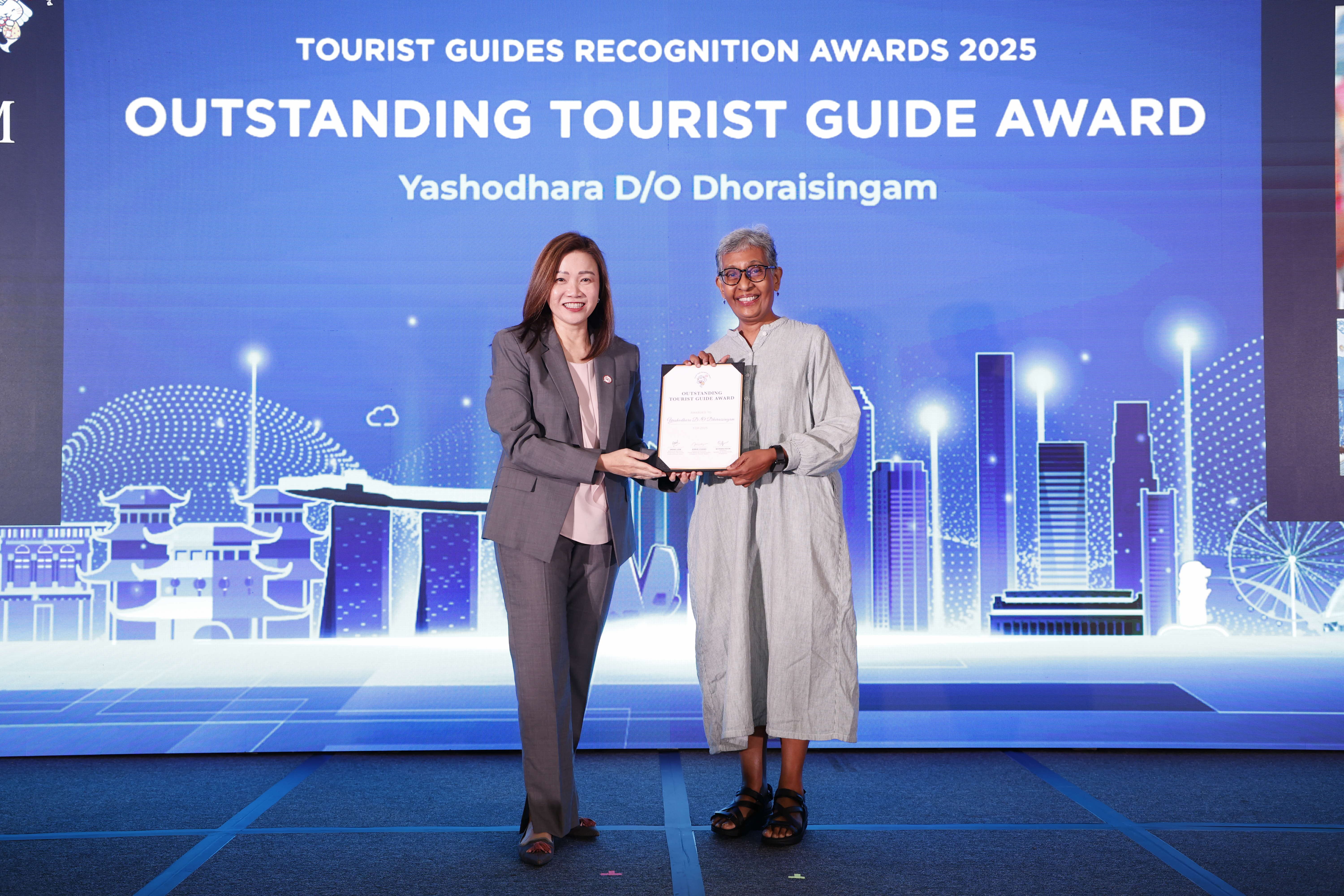 Yashodhara D/O Dhoraisingam being presented the Outstanding Tourist Guide Award by STB Chief Executive Ms Melissa Ow.