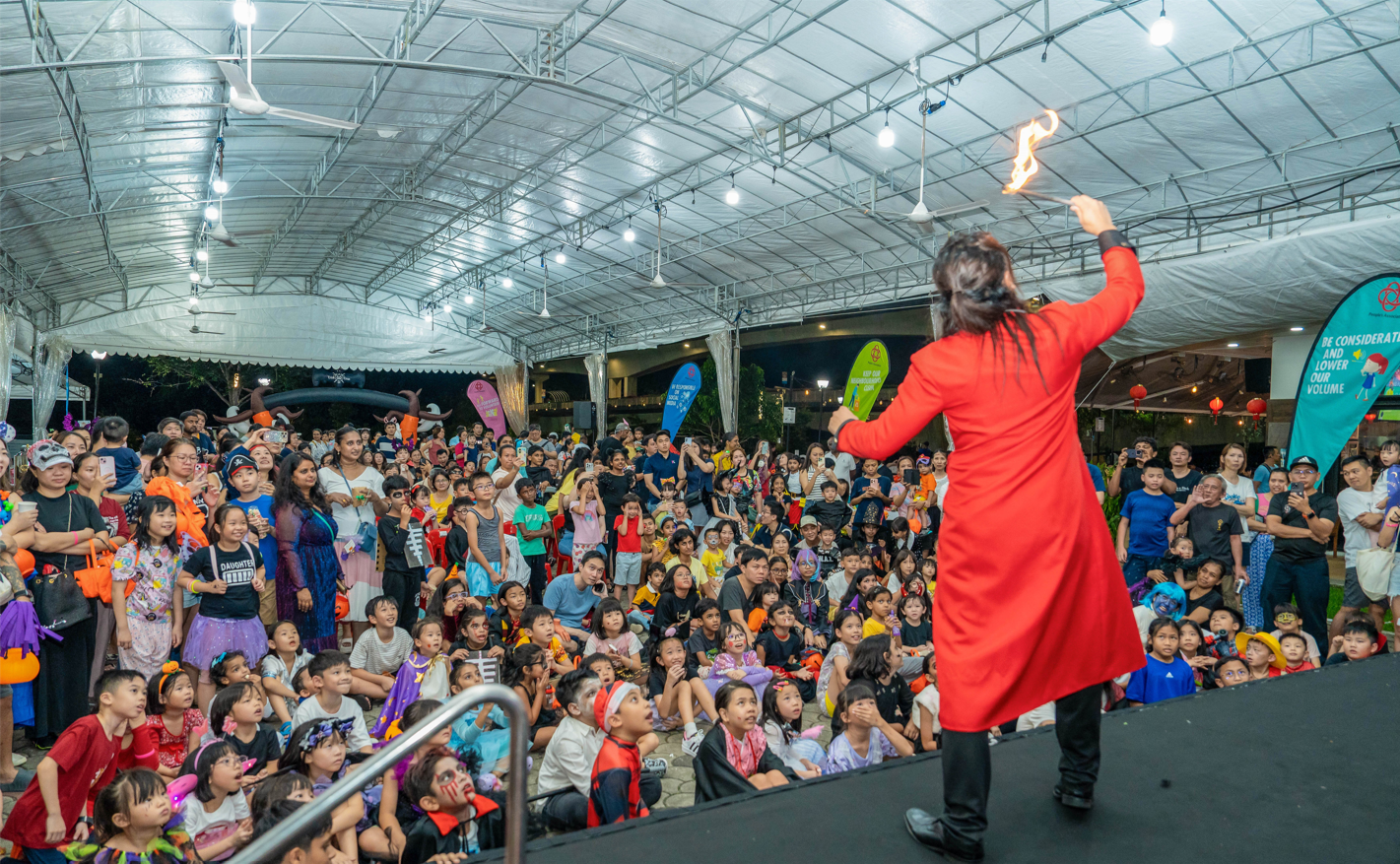 Sengkang West residents enjoying a local talent show