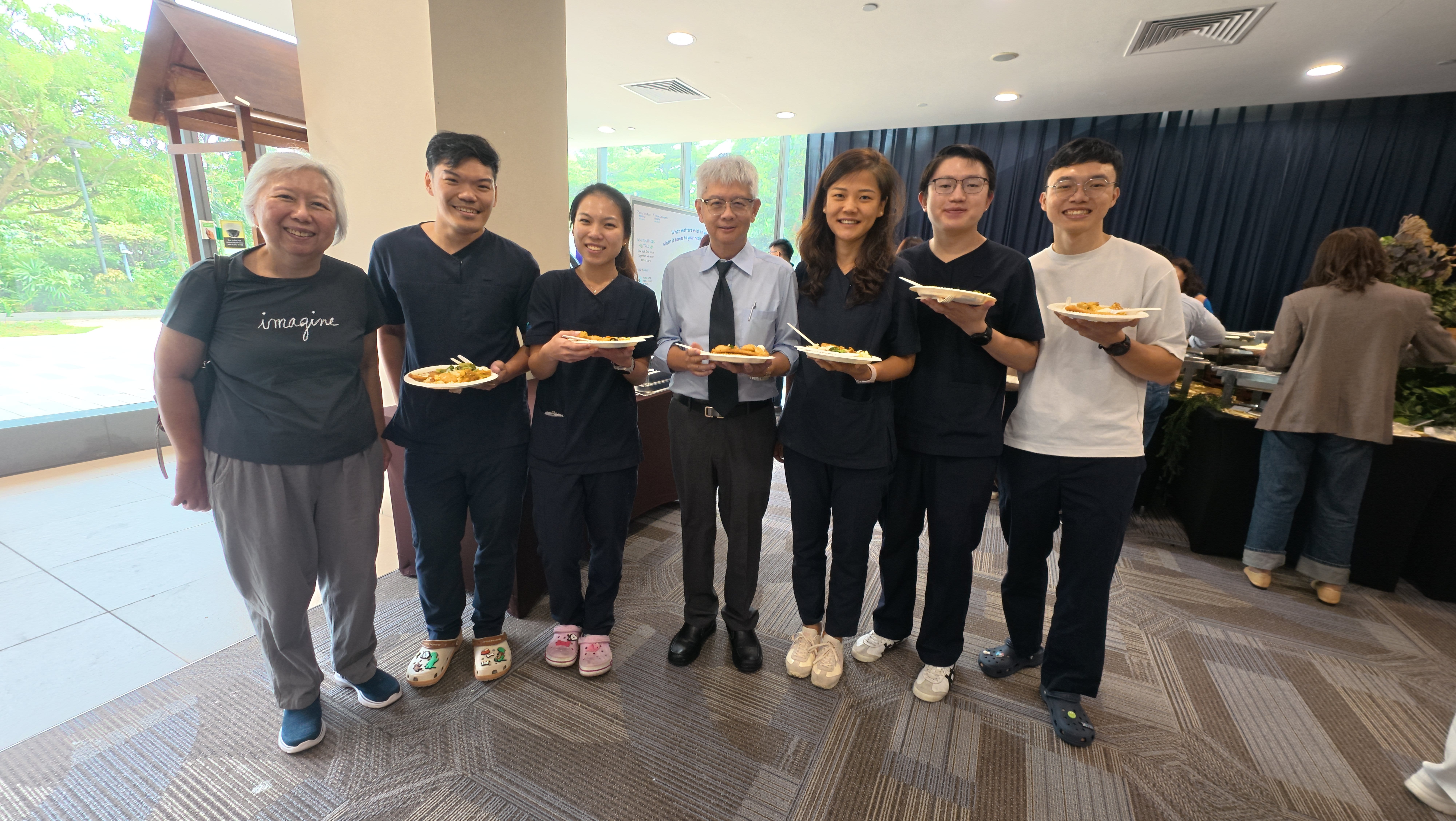 Prof Eillyne Seow and Prof Goh Siang Hiong with EM residents