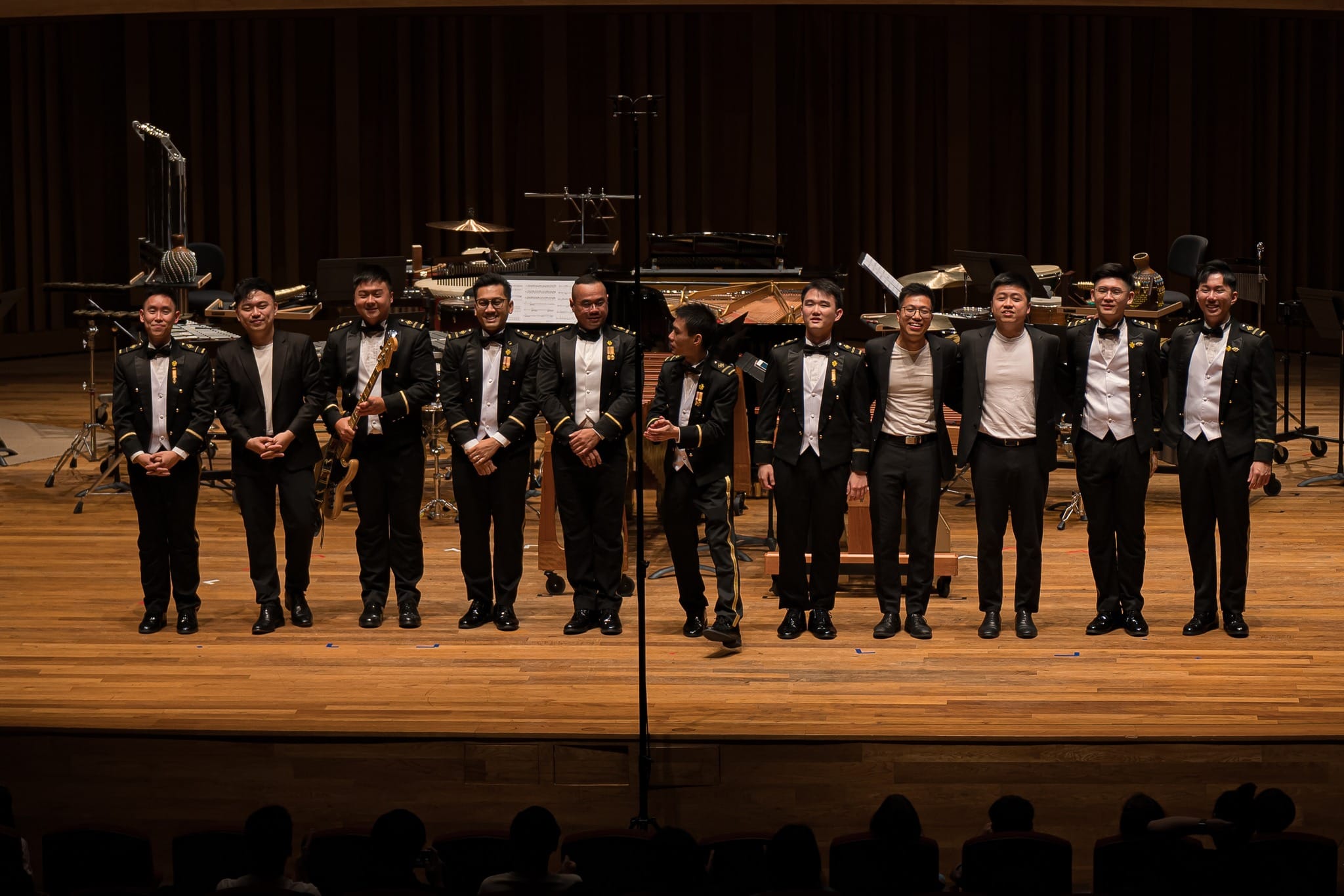 3Beat Percussion and Morse Percussion standing together for the curtain call.