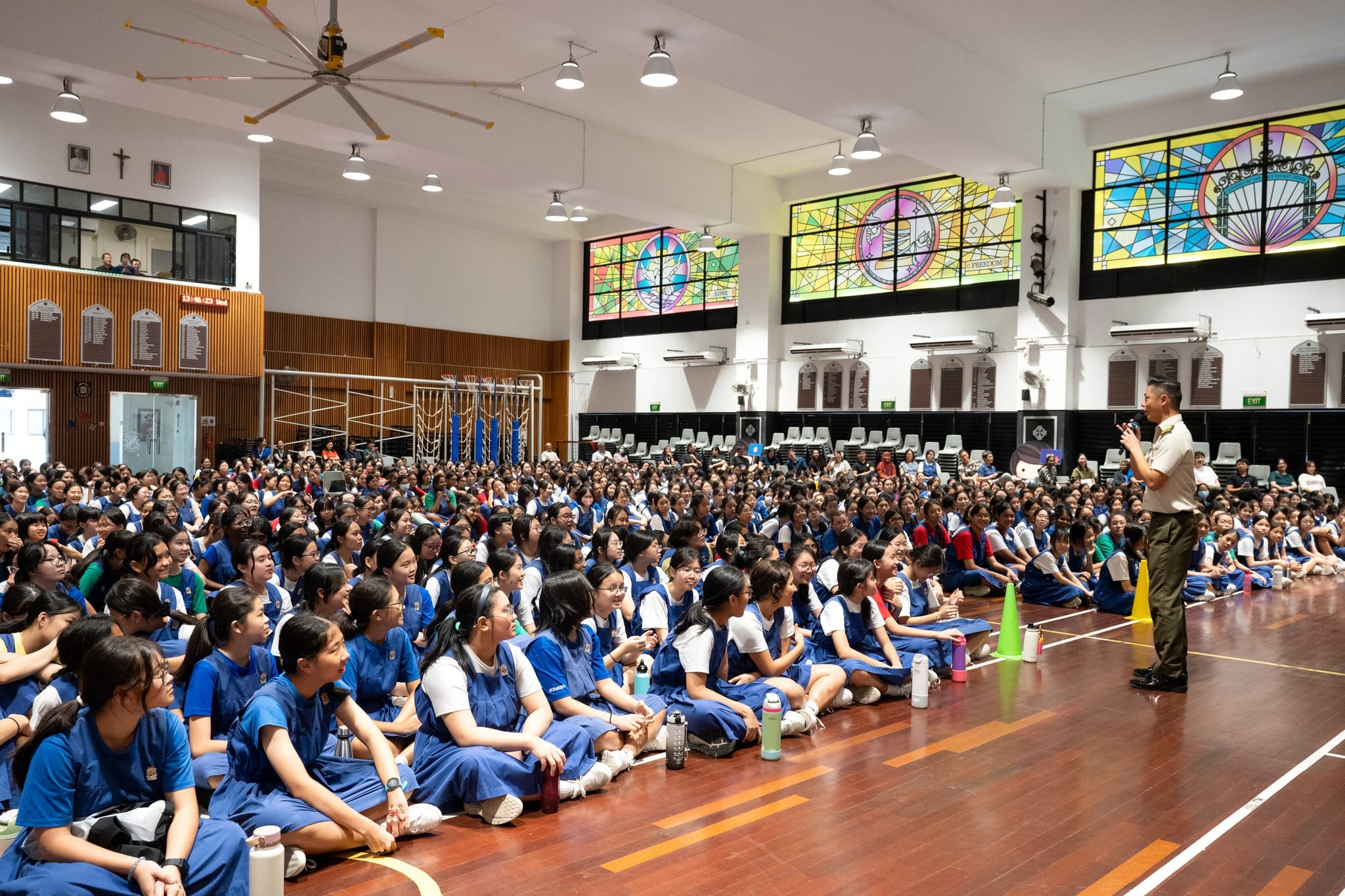Director of Music Military Expert (ME) 5 Ignatius Wang addressing the students, teachers, and staff.