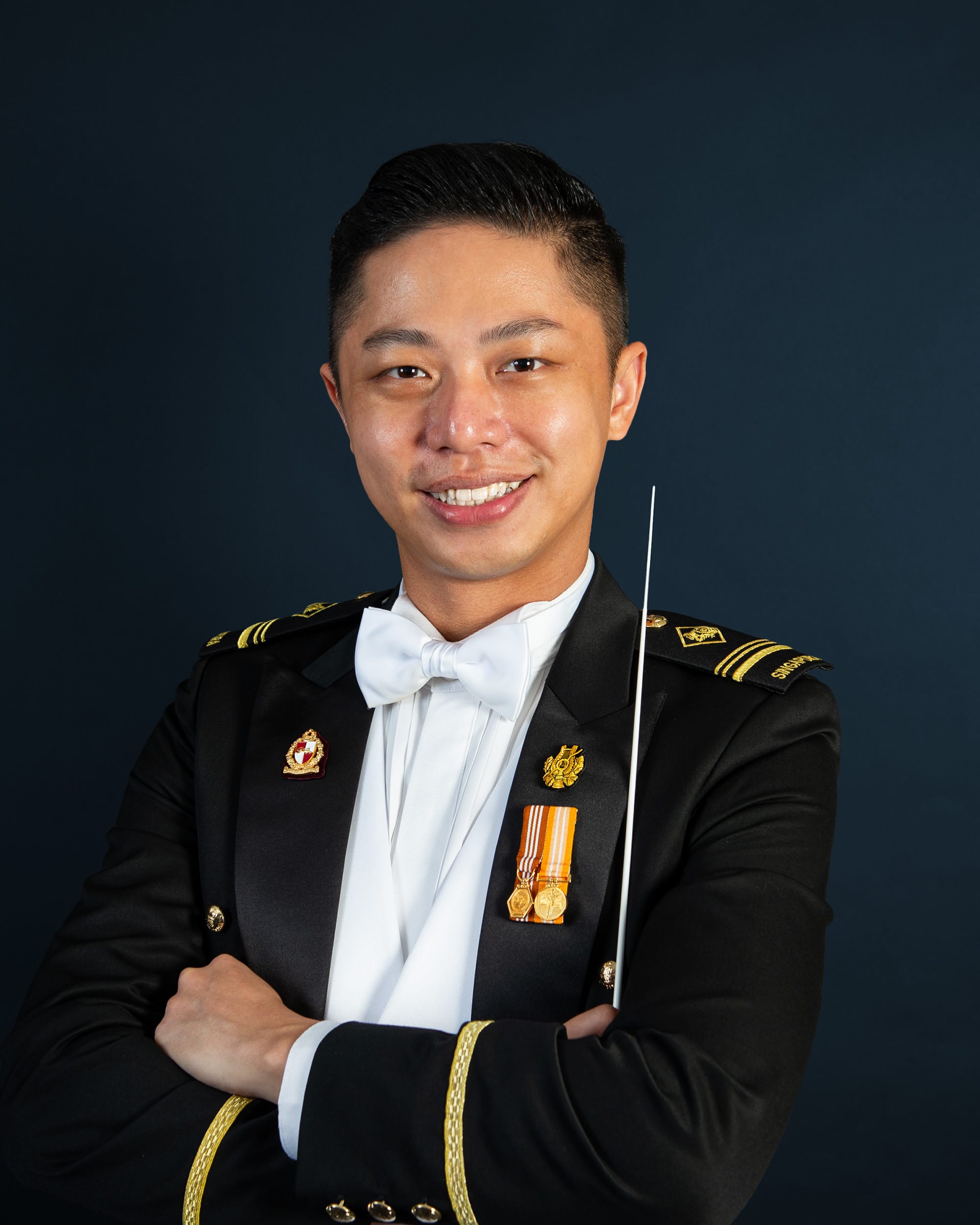Portrait of ME5 Ignatius Wang in mess dress uniform with baton, featured on the SAF Central Band site.