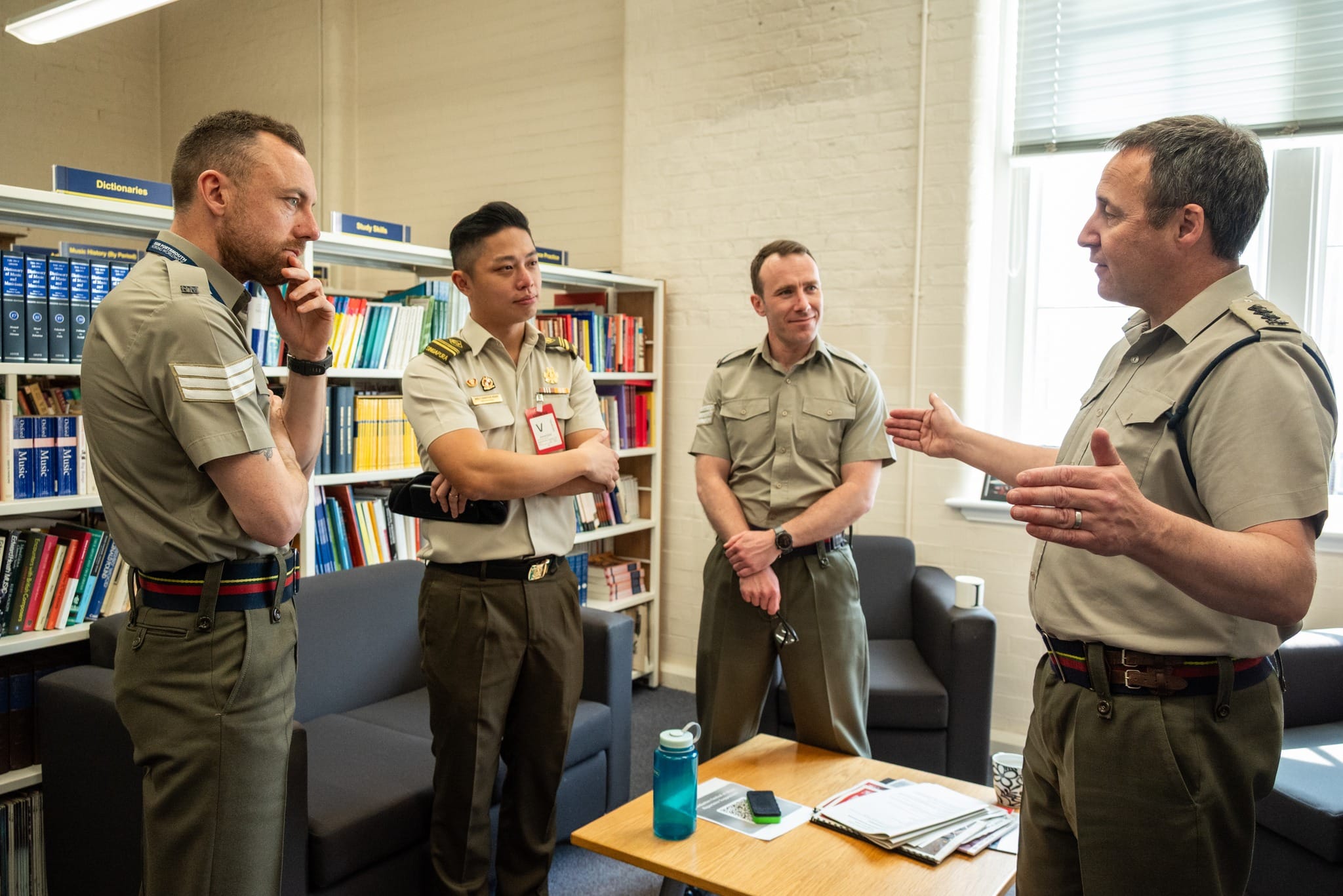 Cpt Matt Weites (right), Director of Music for the RM Band Portsmouth engaging ME5 Wang.