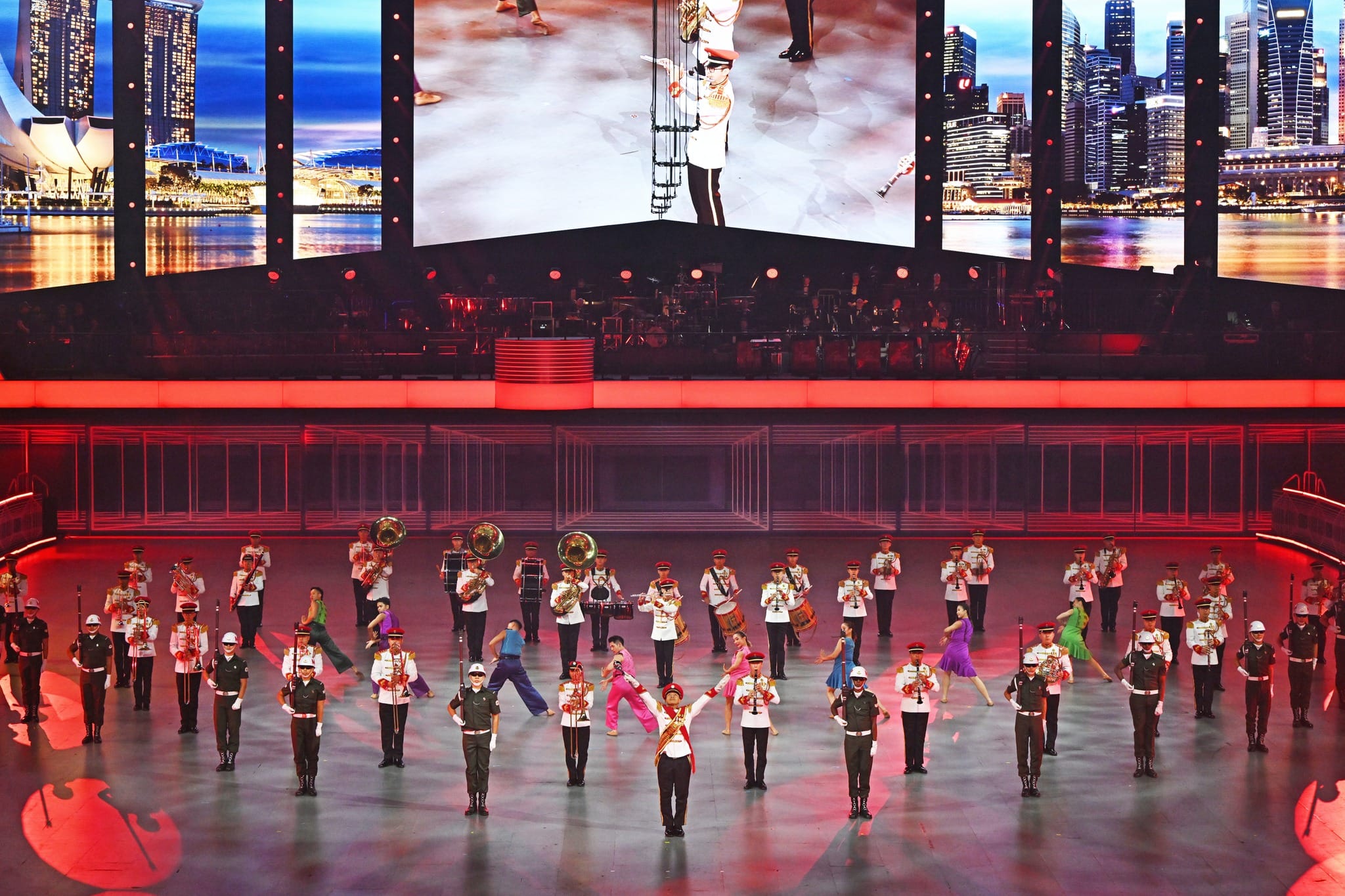 The band formed in the shape of a heart, one of the many formations within the tattoo show.