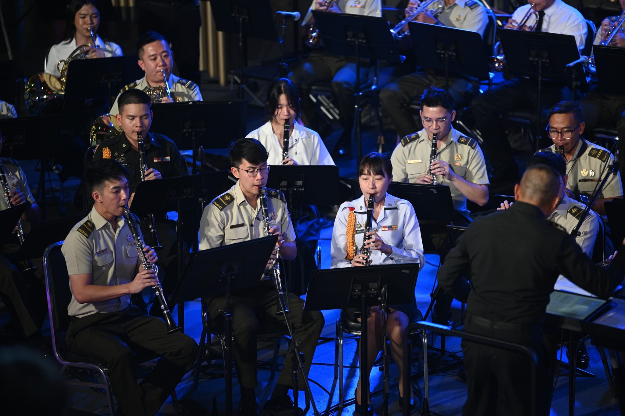 The combined clarinet section in performance.