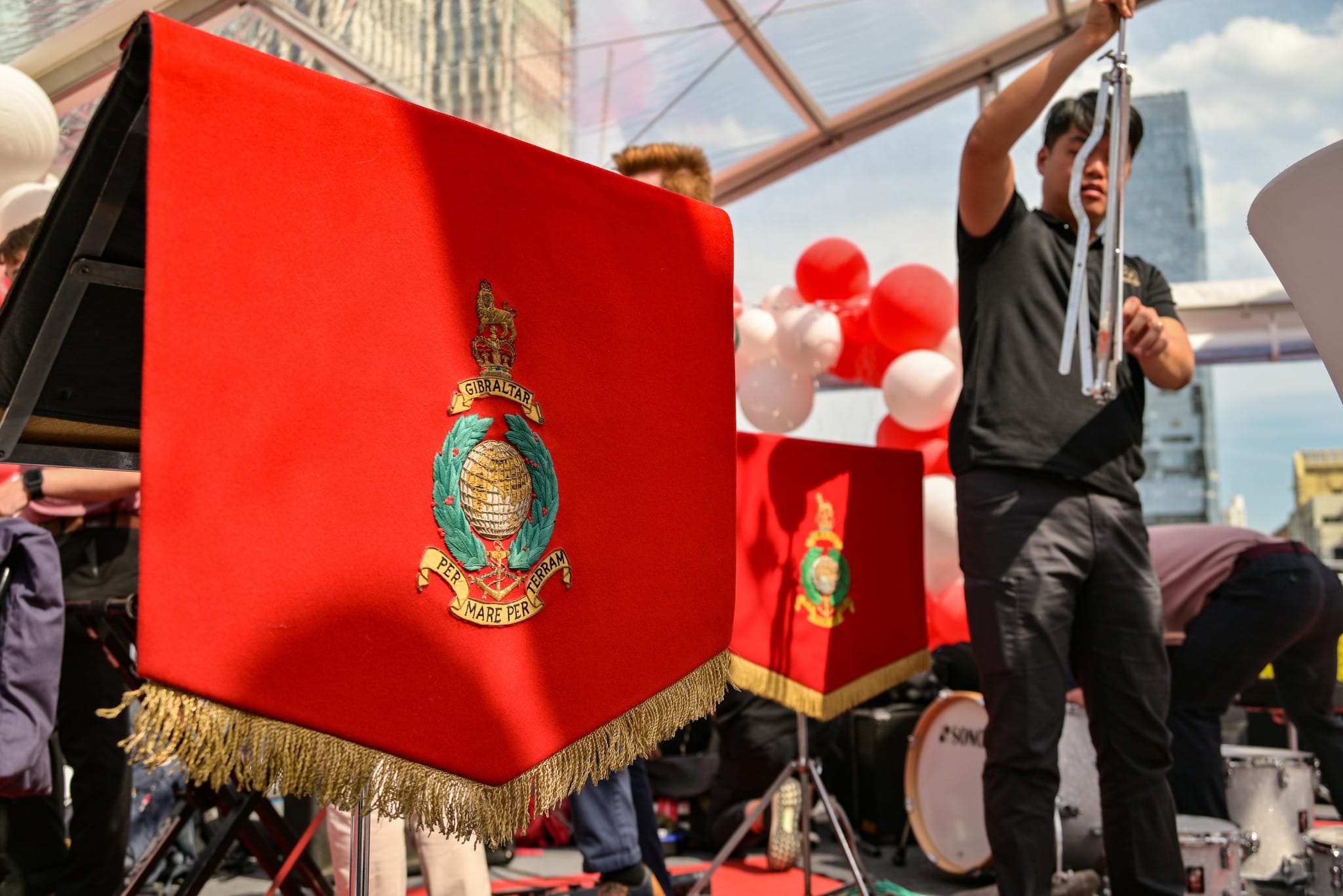 Stand flags bearing the insignia of the RM Band Service.