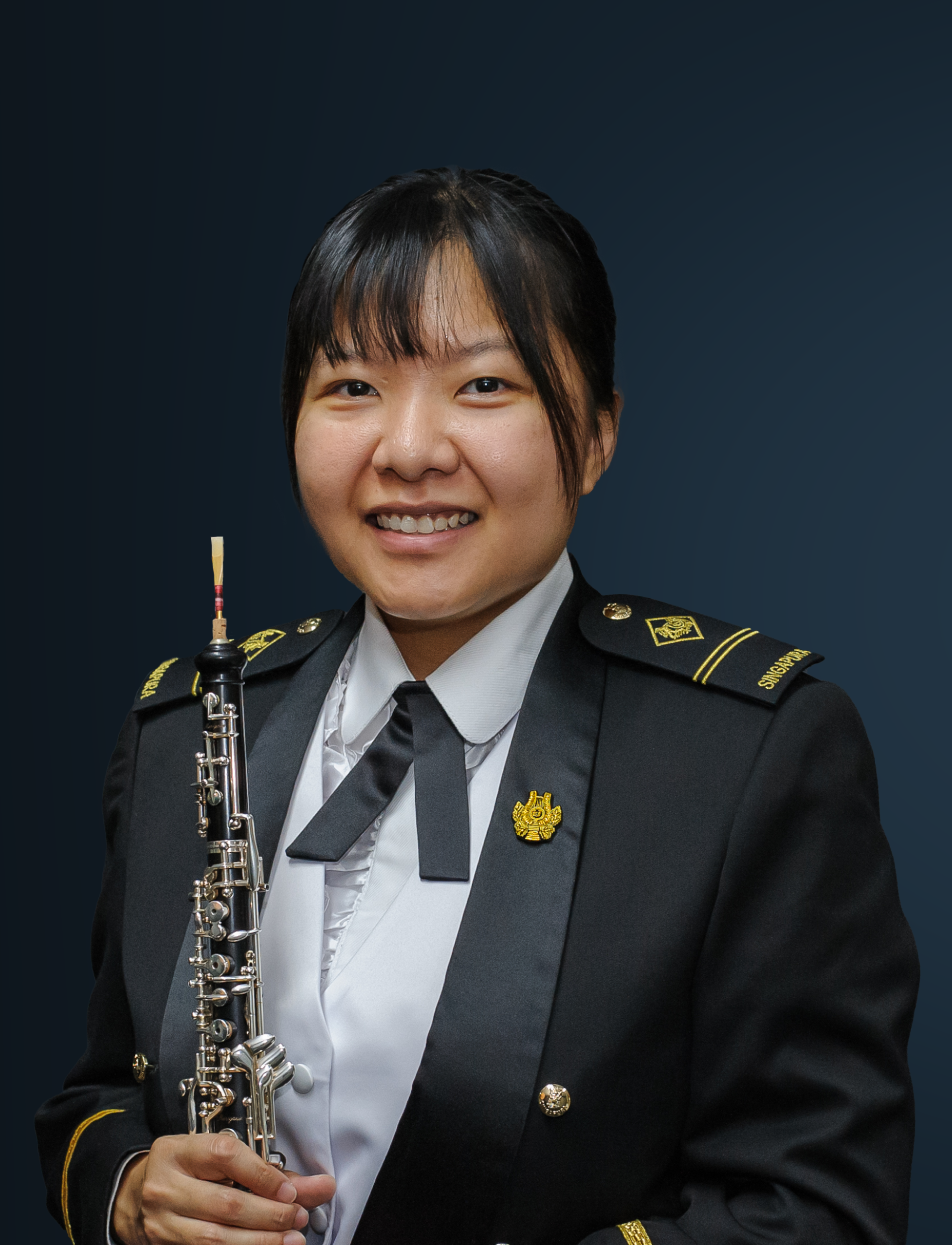 Headshot of Principal Oboe ME2 Leow Rui Qing in concert dress.