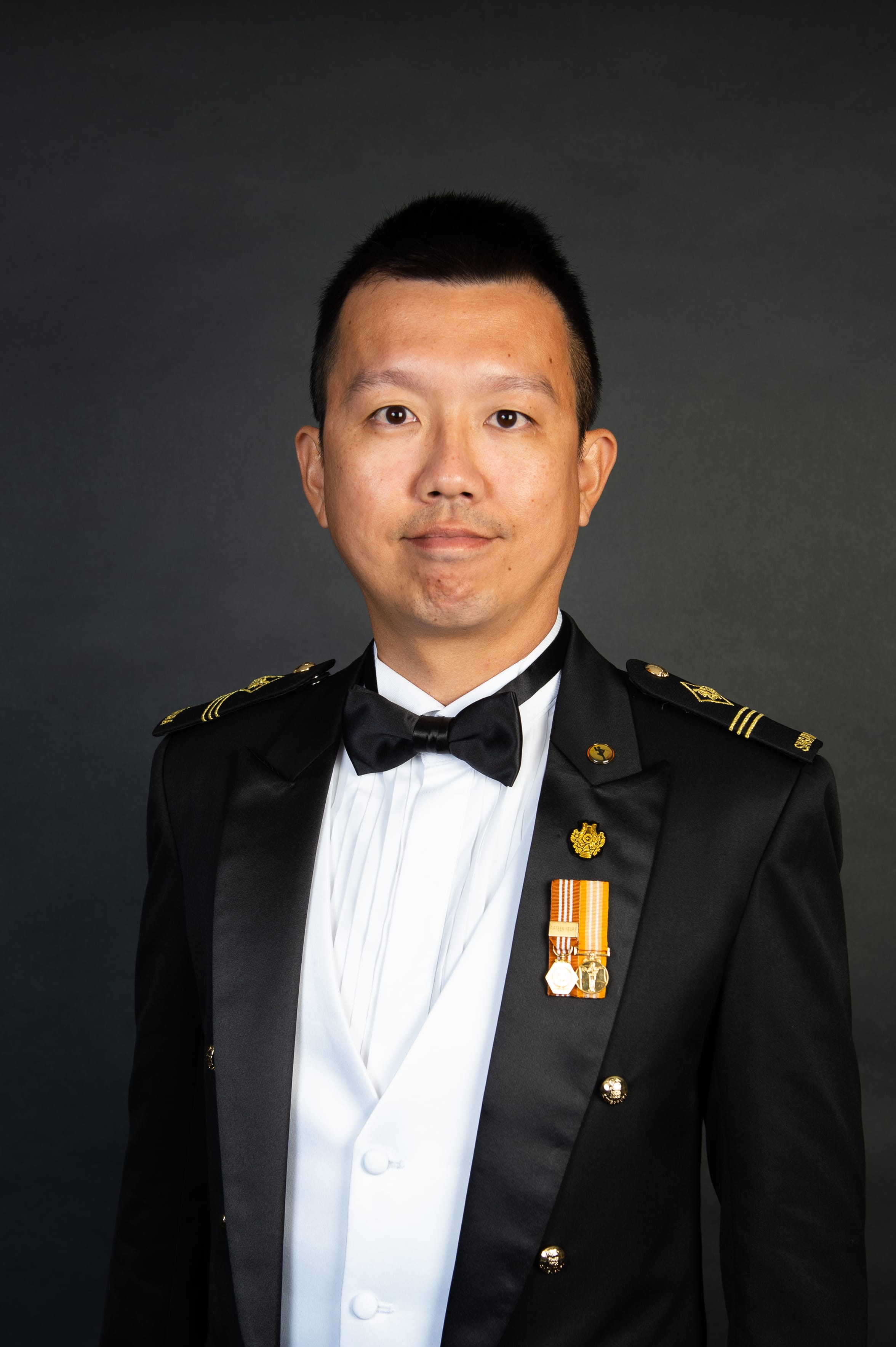 Portrait of ME3 Chiu Boon Hwee in uniform with a euphonium.