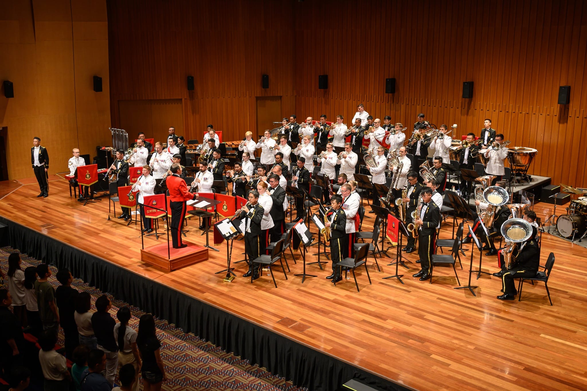 Combined band performing the national anthems of the UK and Singapore.
