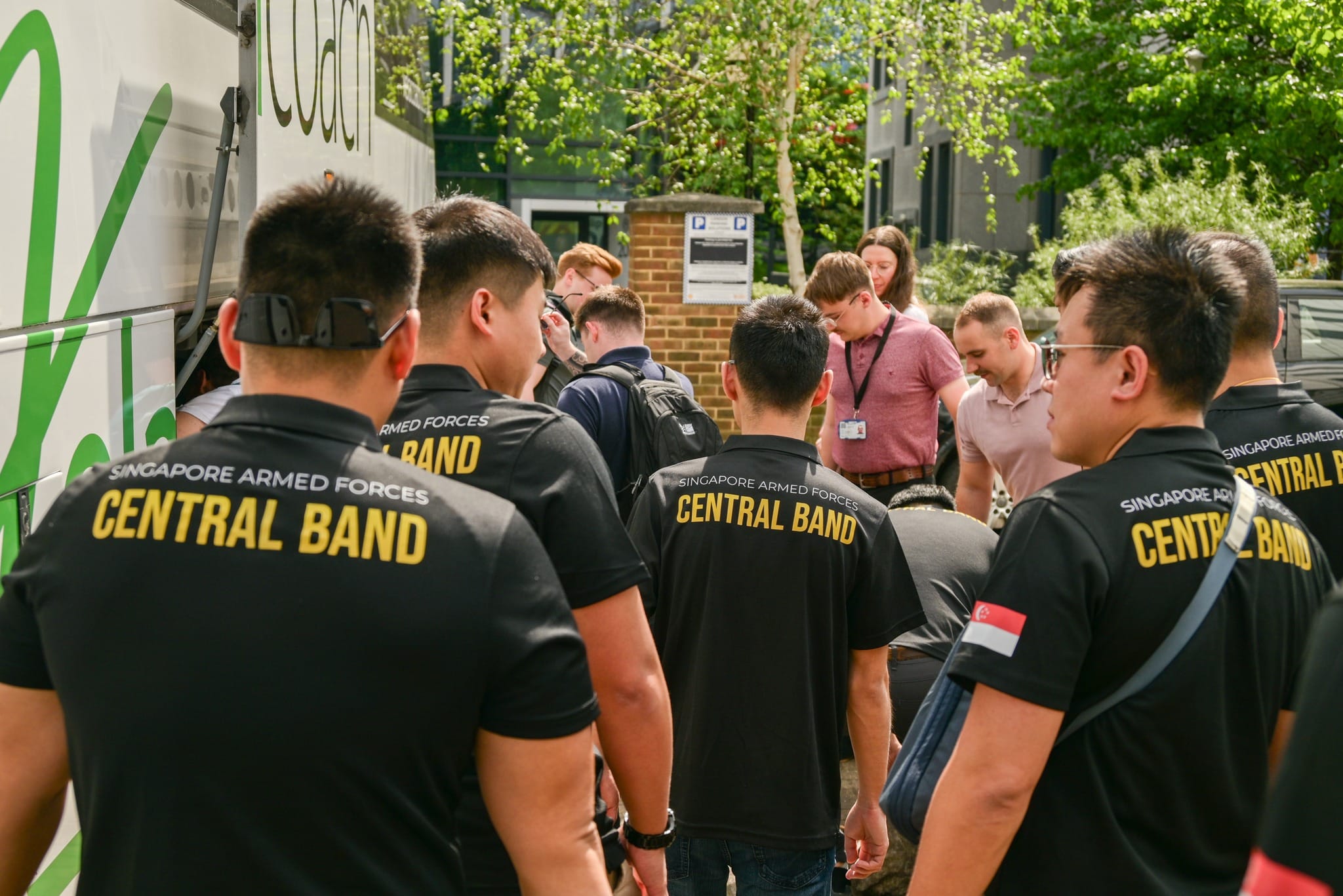 The SAF Central Band welcoming musicians from the RM Band Collingwood and assisting in setup thereafter.