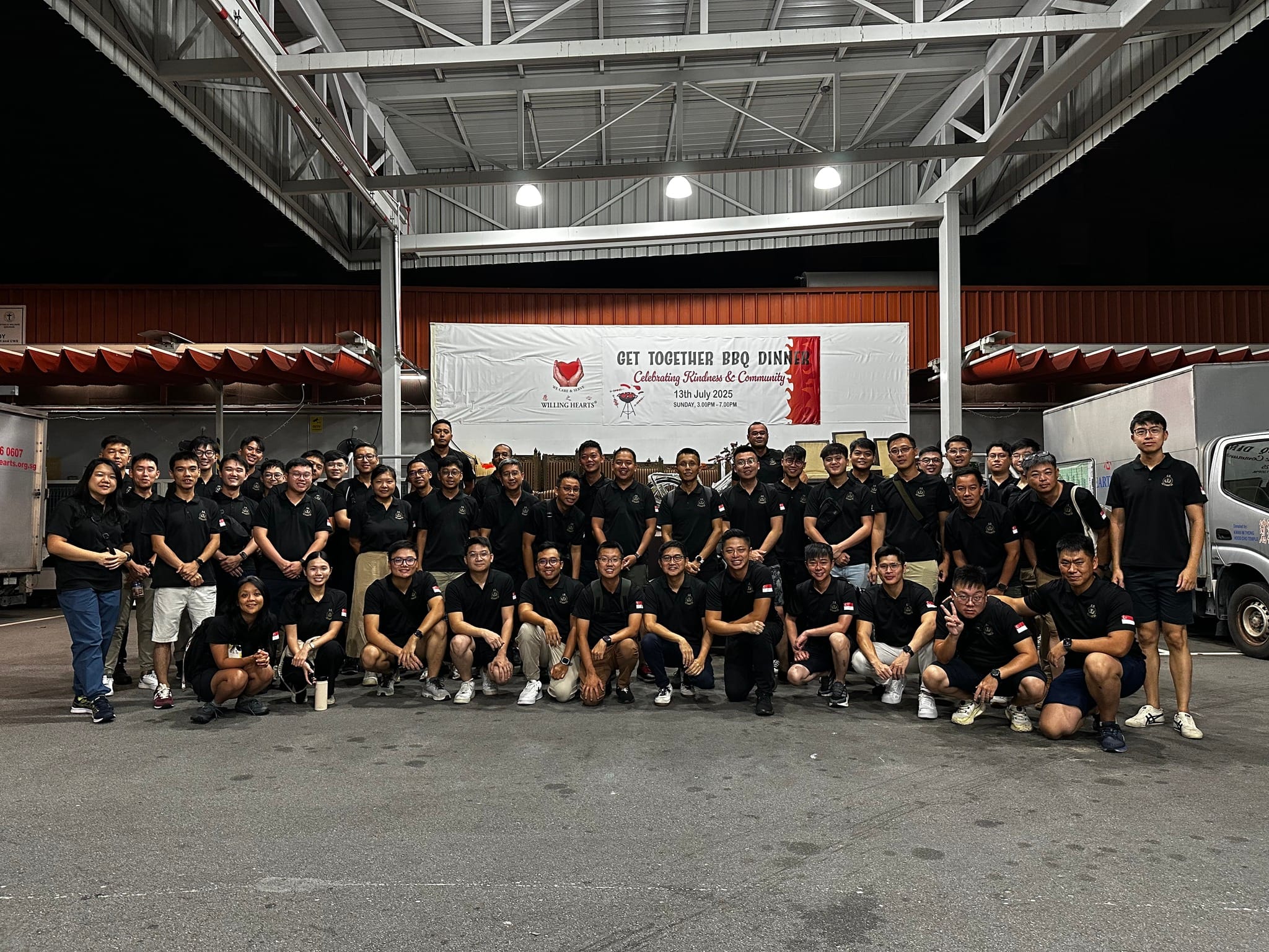 The SAF Central Band gathering for a group photo ahead of their volunteering shift.