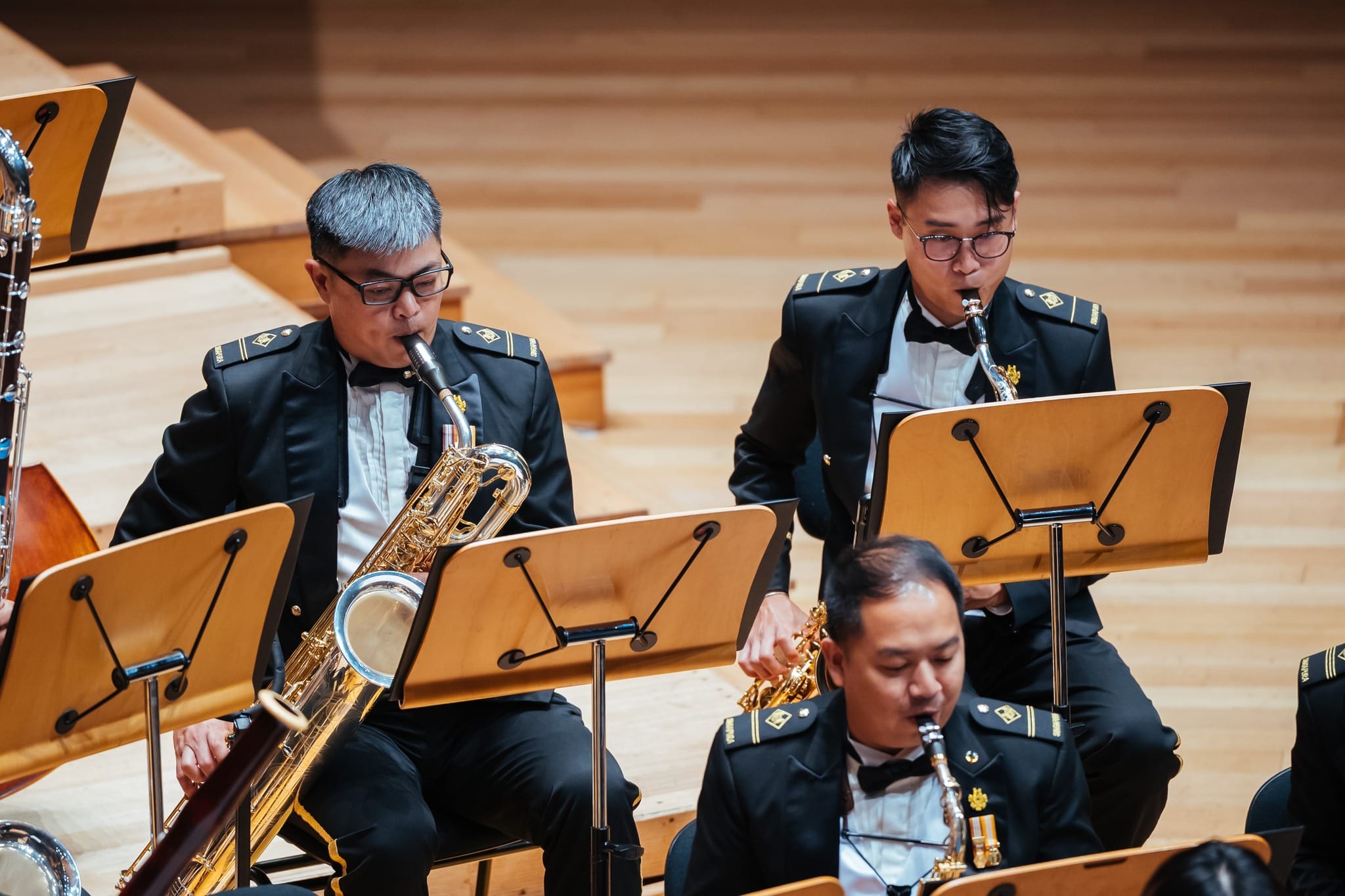 Saxophonists ME2 Lim Yik Chin, Jonathan (left), ME1 Gao Yewei (right), and ME2 Pee Jun Ming (front) in performance.