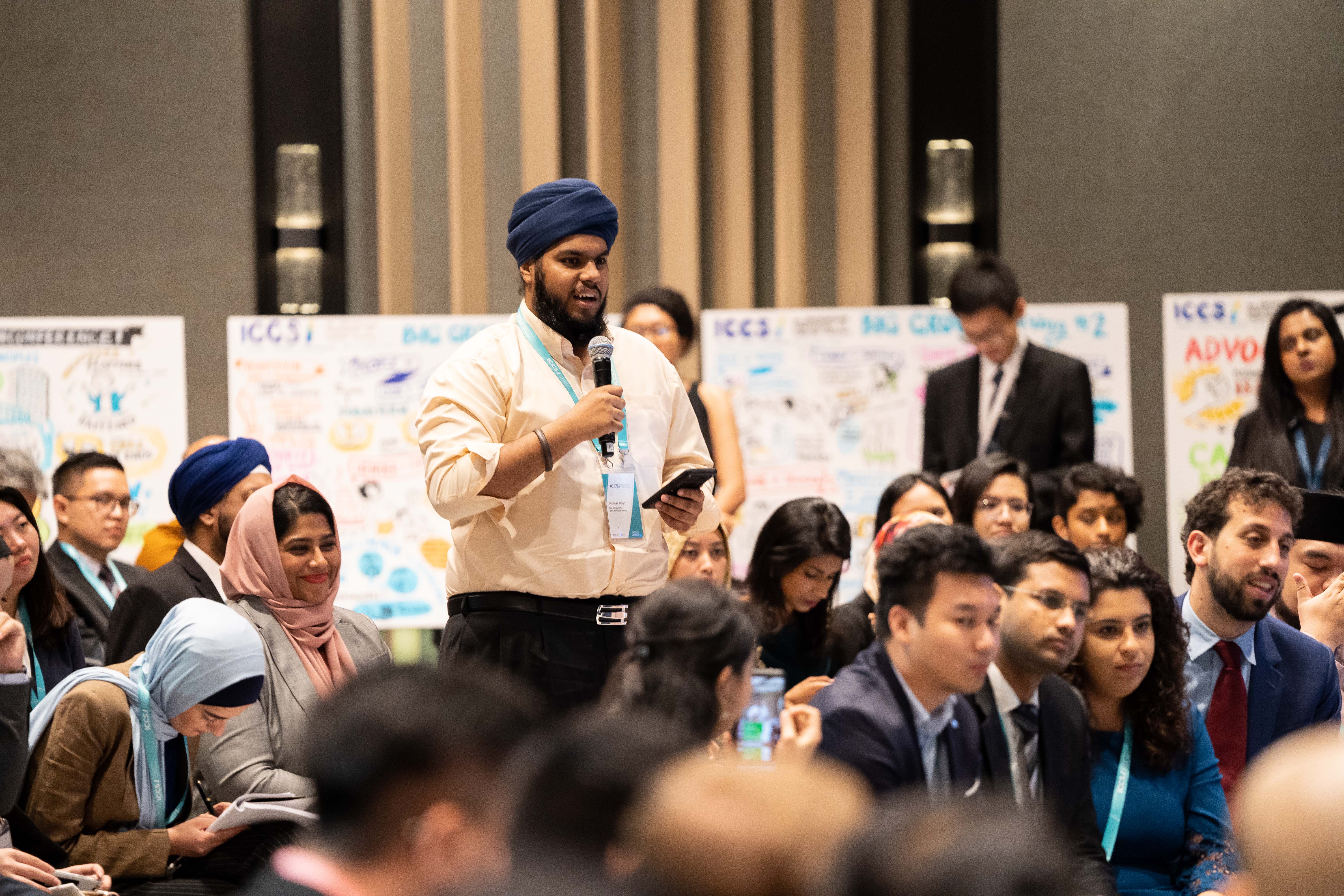 Photo of delegate asking question during ICCS 2019
