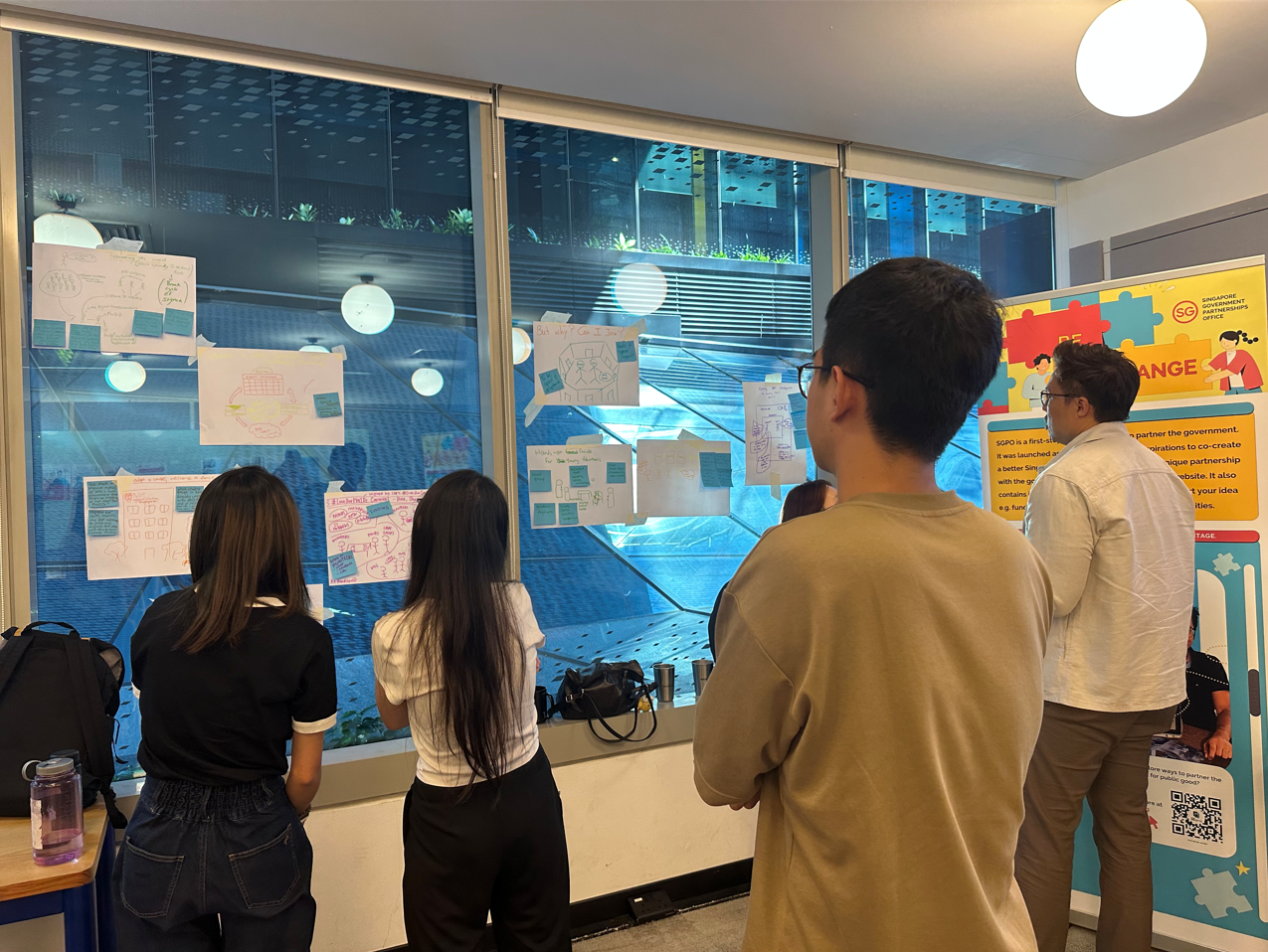 Participants learning about each other's ideas through display of work that was done individually