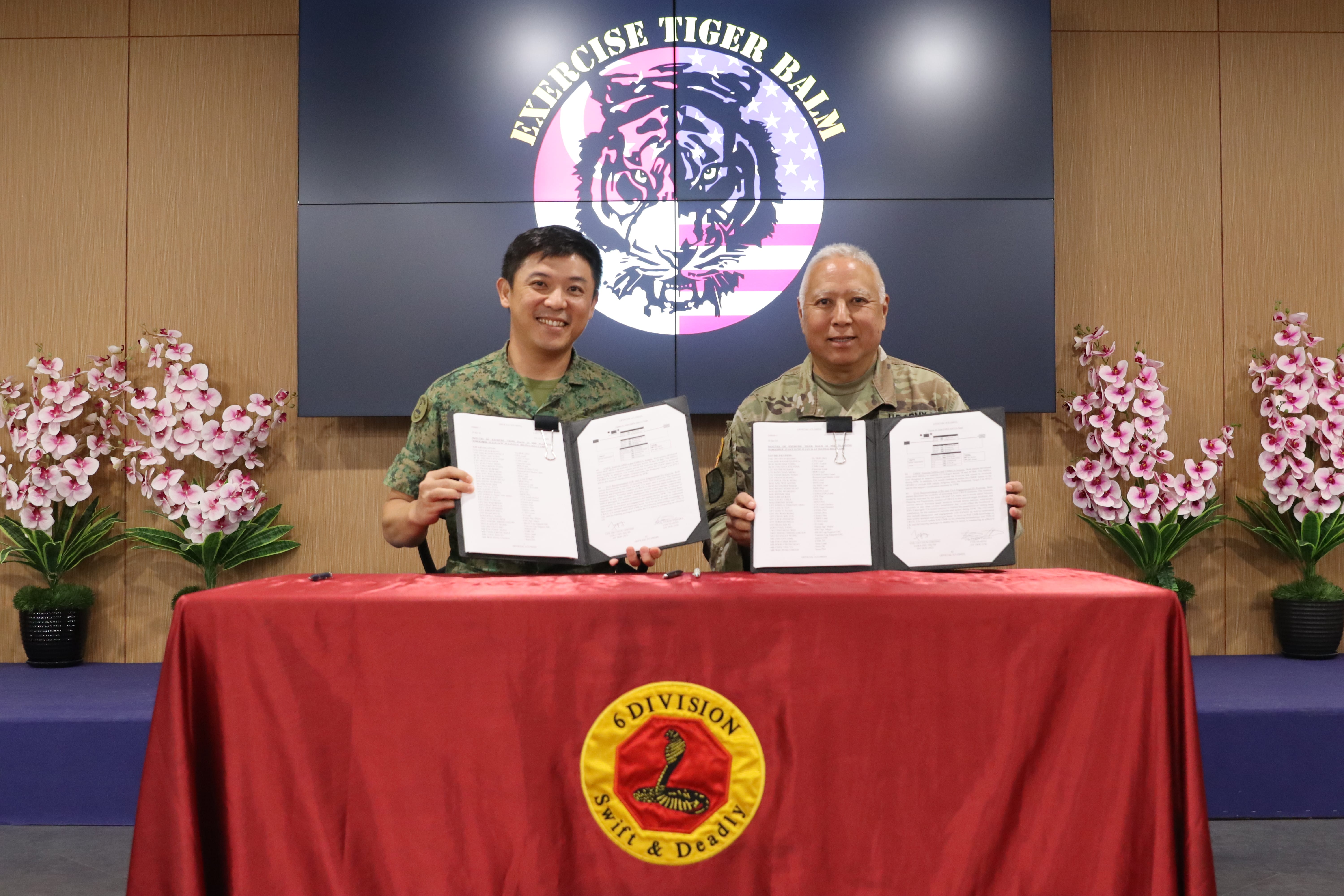 COL Oh and a U.S. officer signing an army exercise agreement.