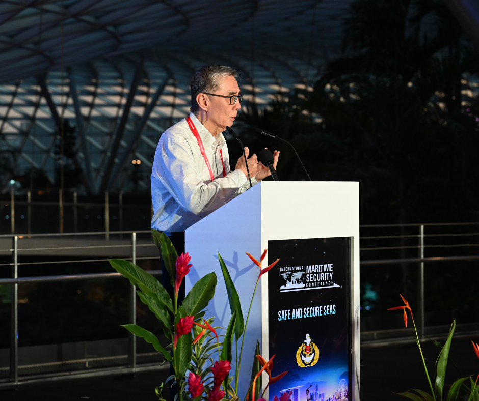 Man at podium speaking at International Maritime Security Conference.