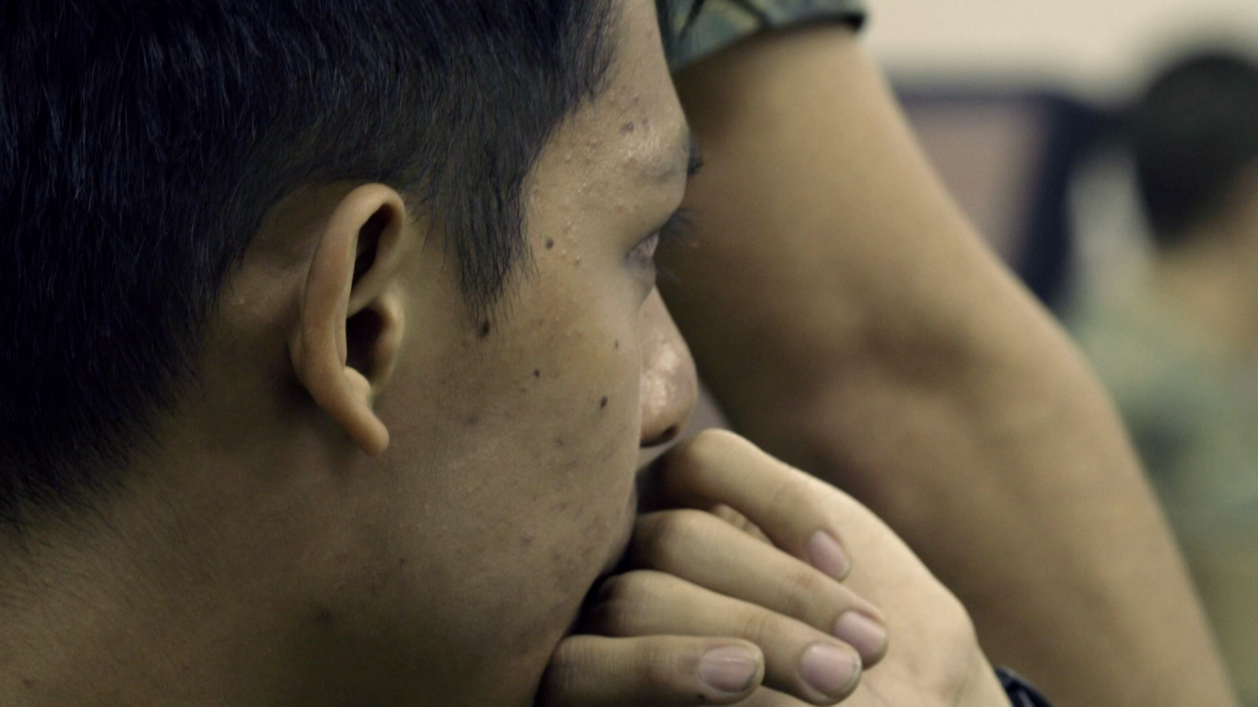 Close-up of SAF personnel listening intently during intelligence training.