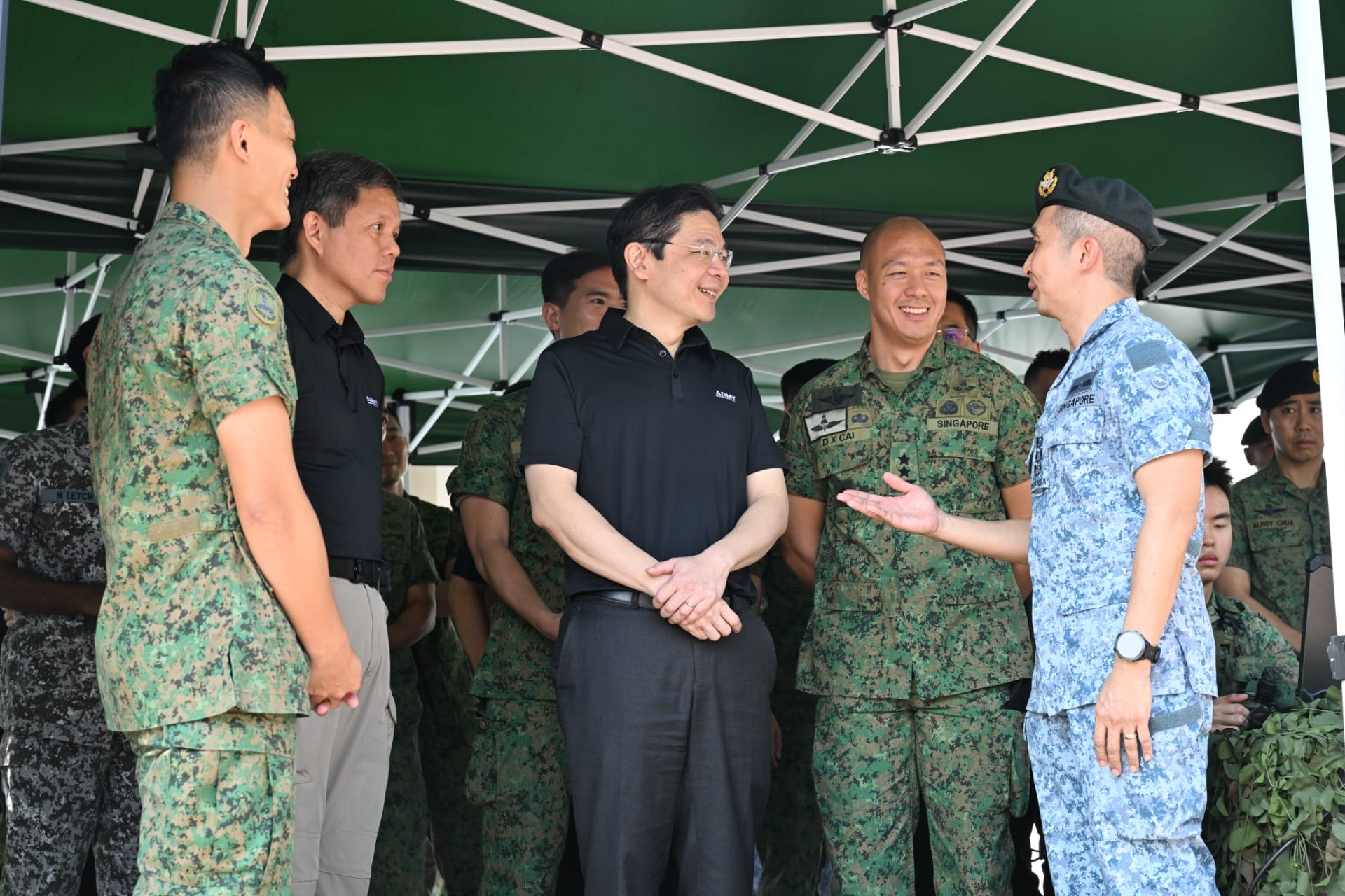 PM Wong receiving a brief on the Urban Sense Strike capabilities showcase.