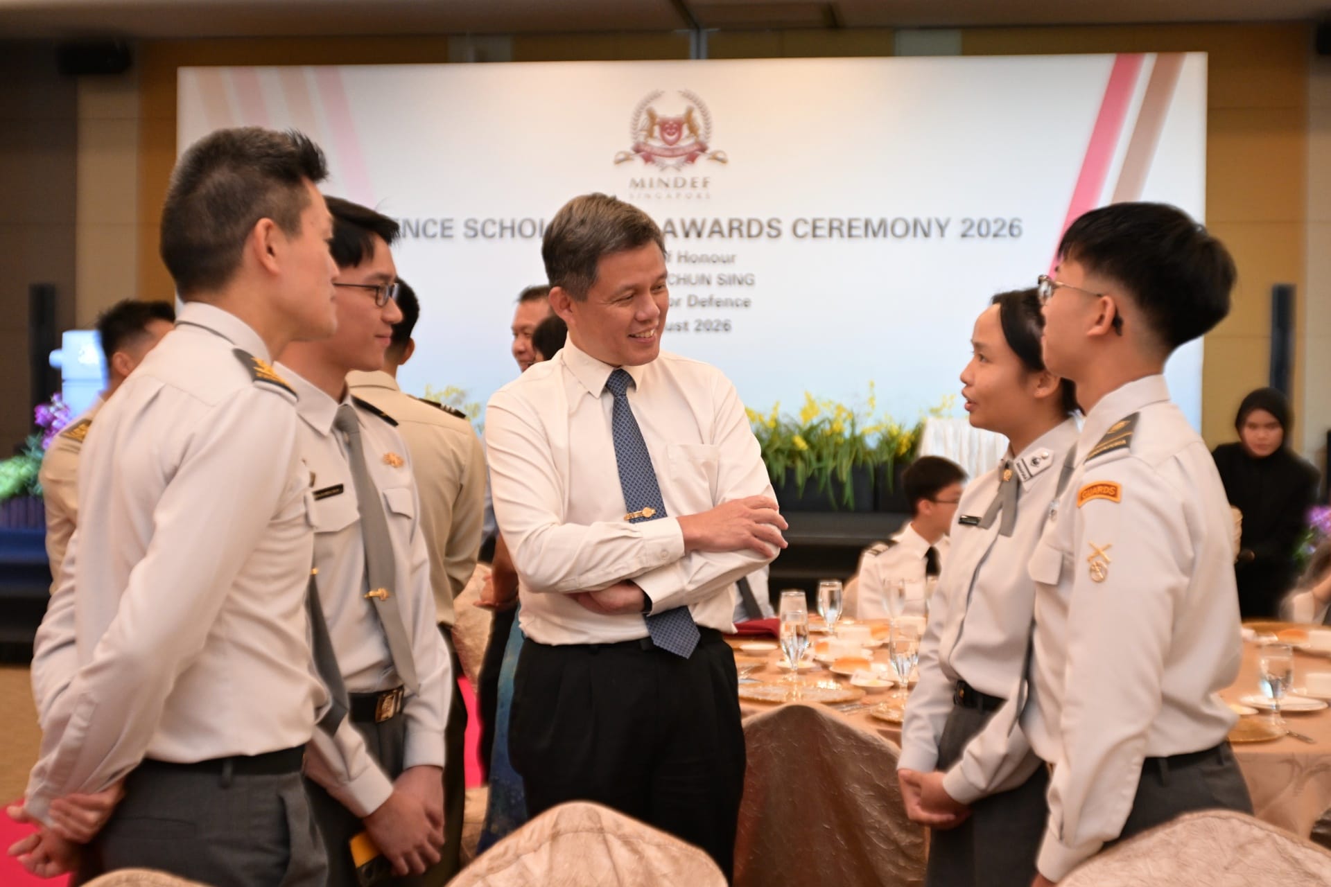 Minister Chan interacting with scholarship recipients at the ceremony.
