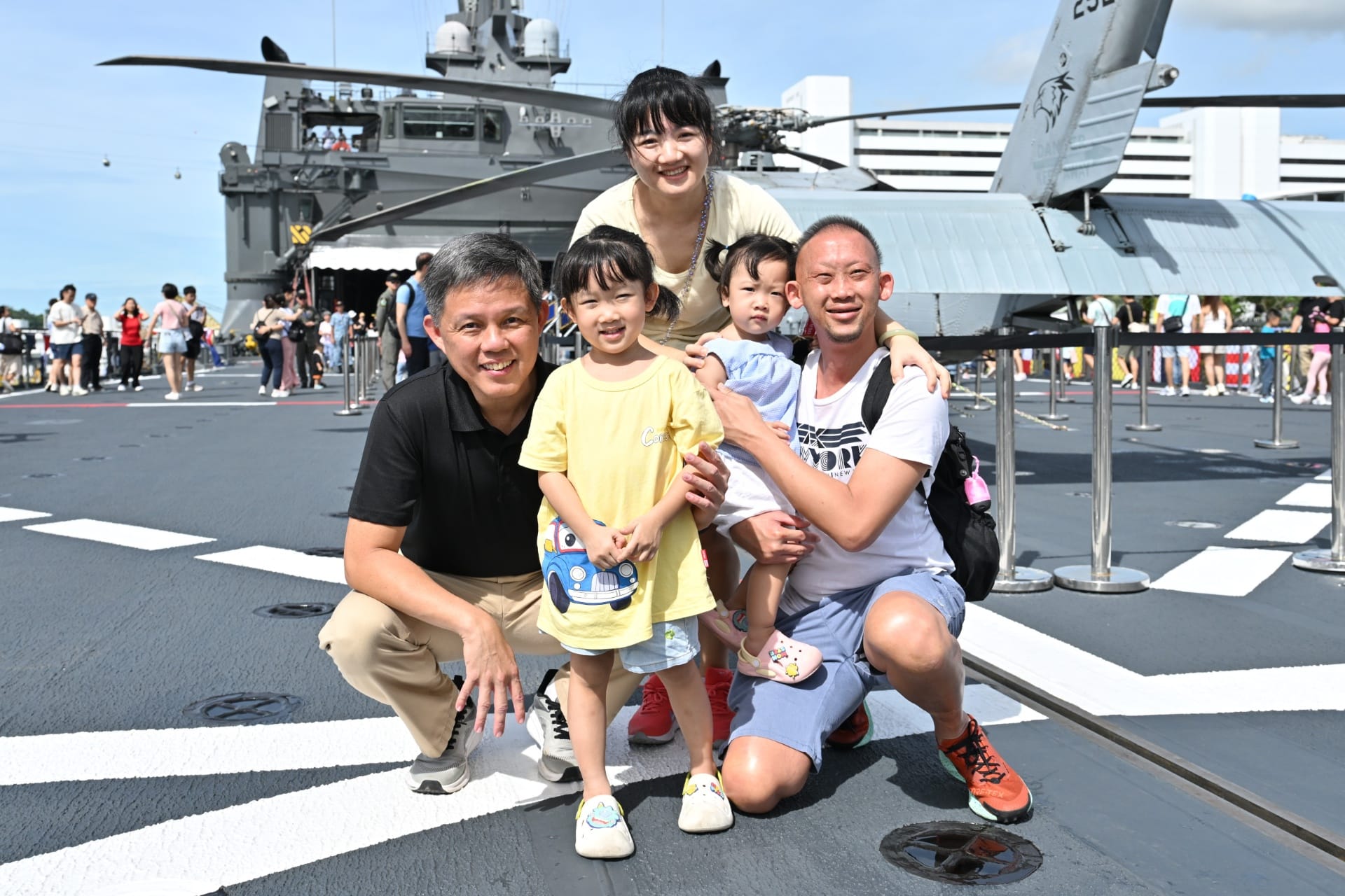 Mr Chan interacting with members of the public on the flight deck of RSS Resolution.