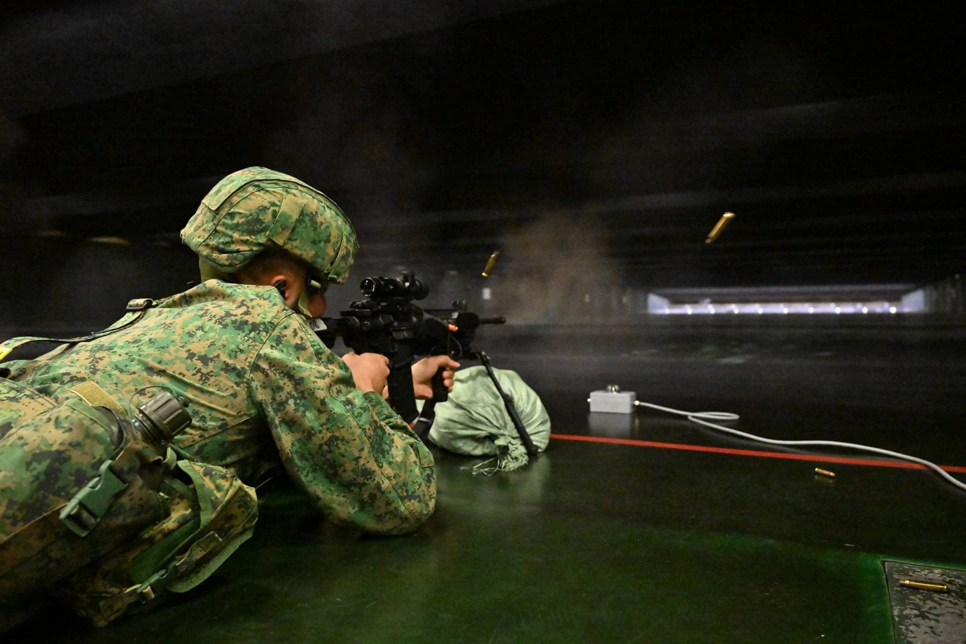 Personnel from the Singapore Army participating in indoor live-firing training at the Multi-Mission Range Complex.