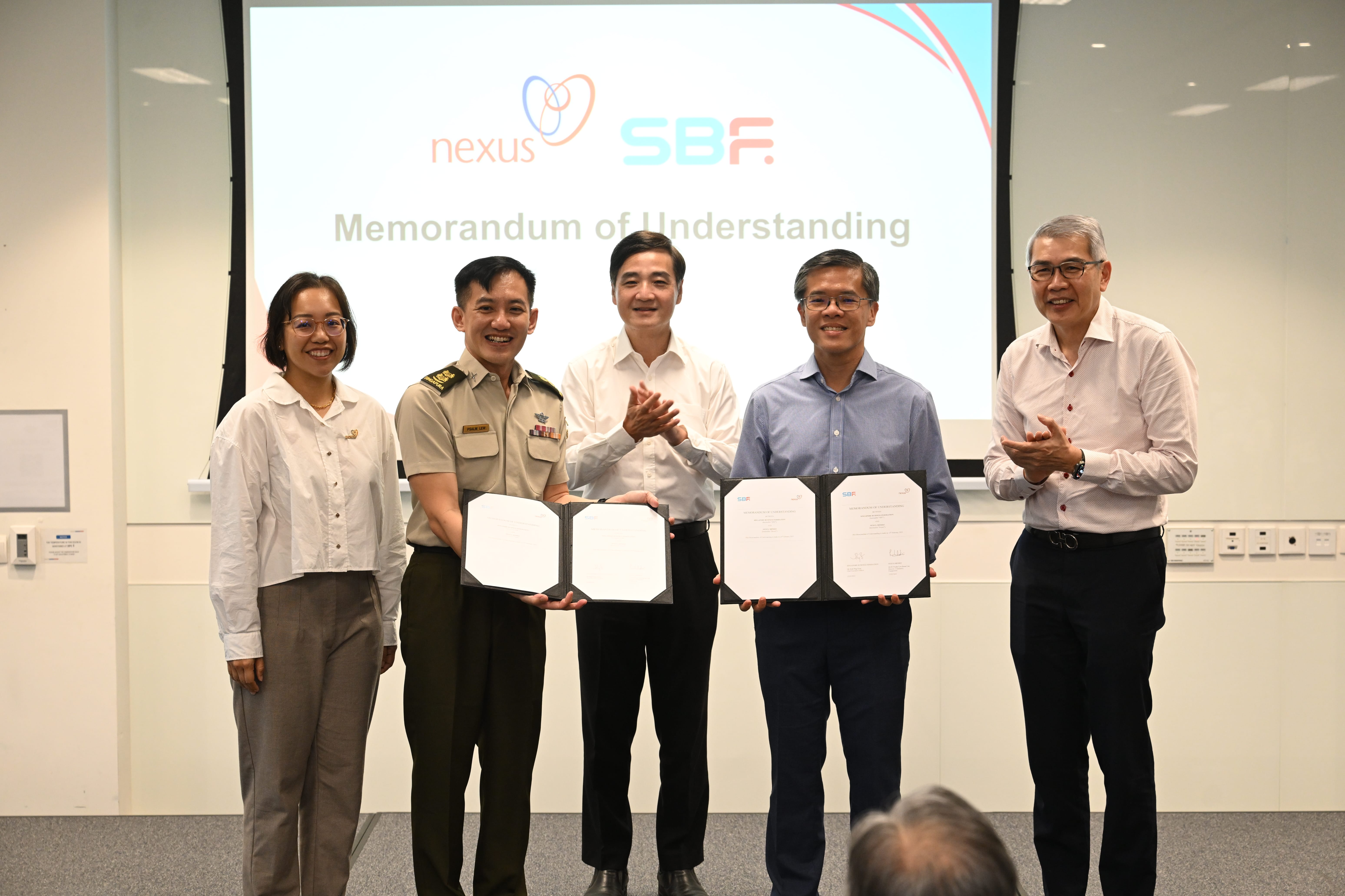 Senior Minister of State for Defence Mr Heng Chee How witnessing the exchanging of the Memorandum of Understanding (MOU) between Nexus, MINDEF and SBF Center to strengthen business organisations’ resilience against cyberthreats. 