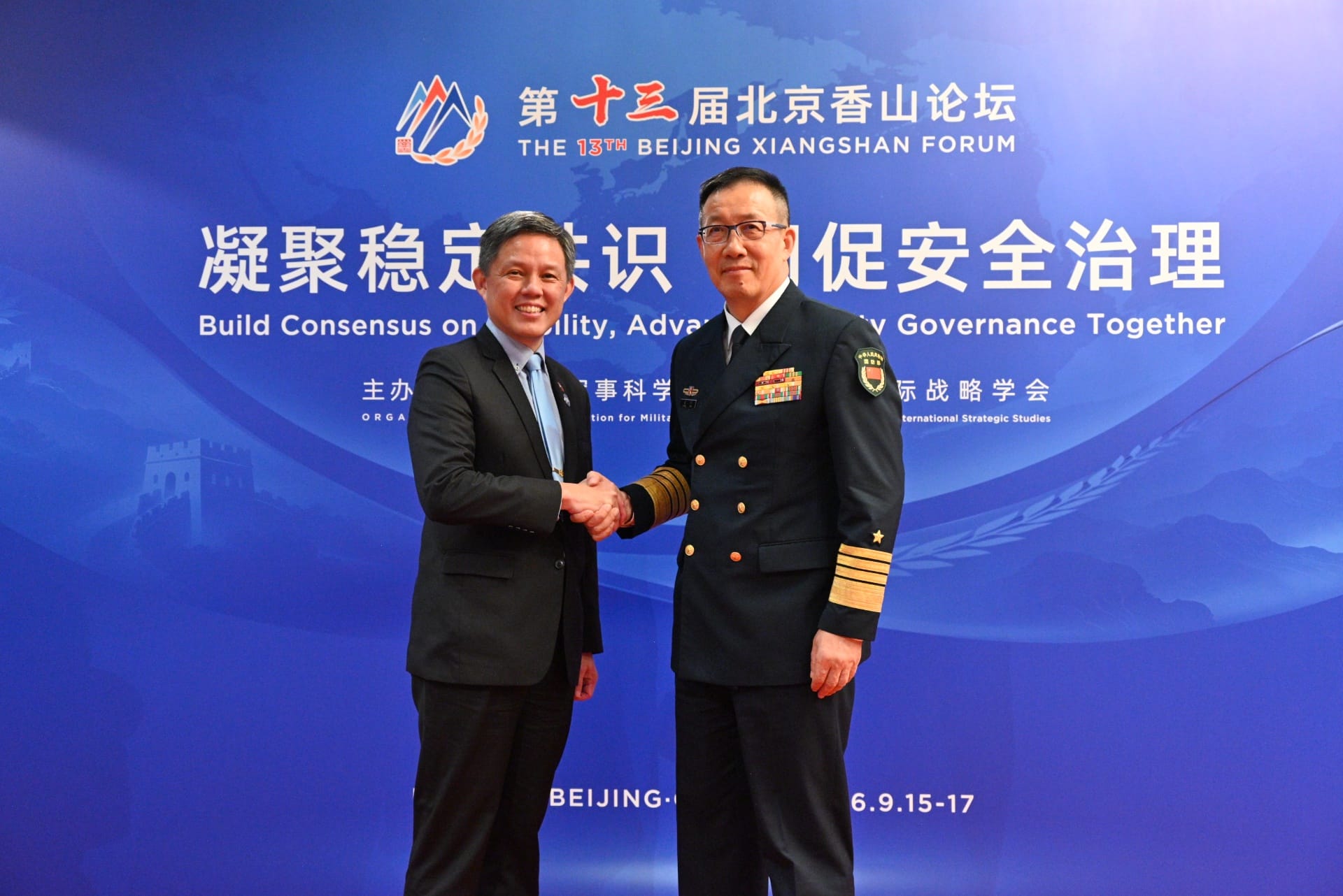 Minister Chan (left) met with China Minister of National Defense Admiral (ADM) Dong Jun (right).