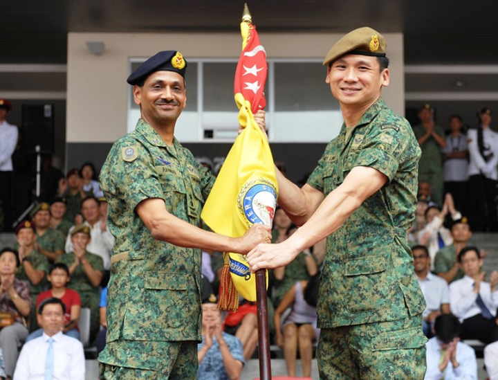 Outgoing Chief of Army, Major-General Ravinder Singh (left), handing over the command symbol to the incoming Chief of Army, Brigadier-General (BG) Perry Lim.