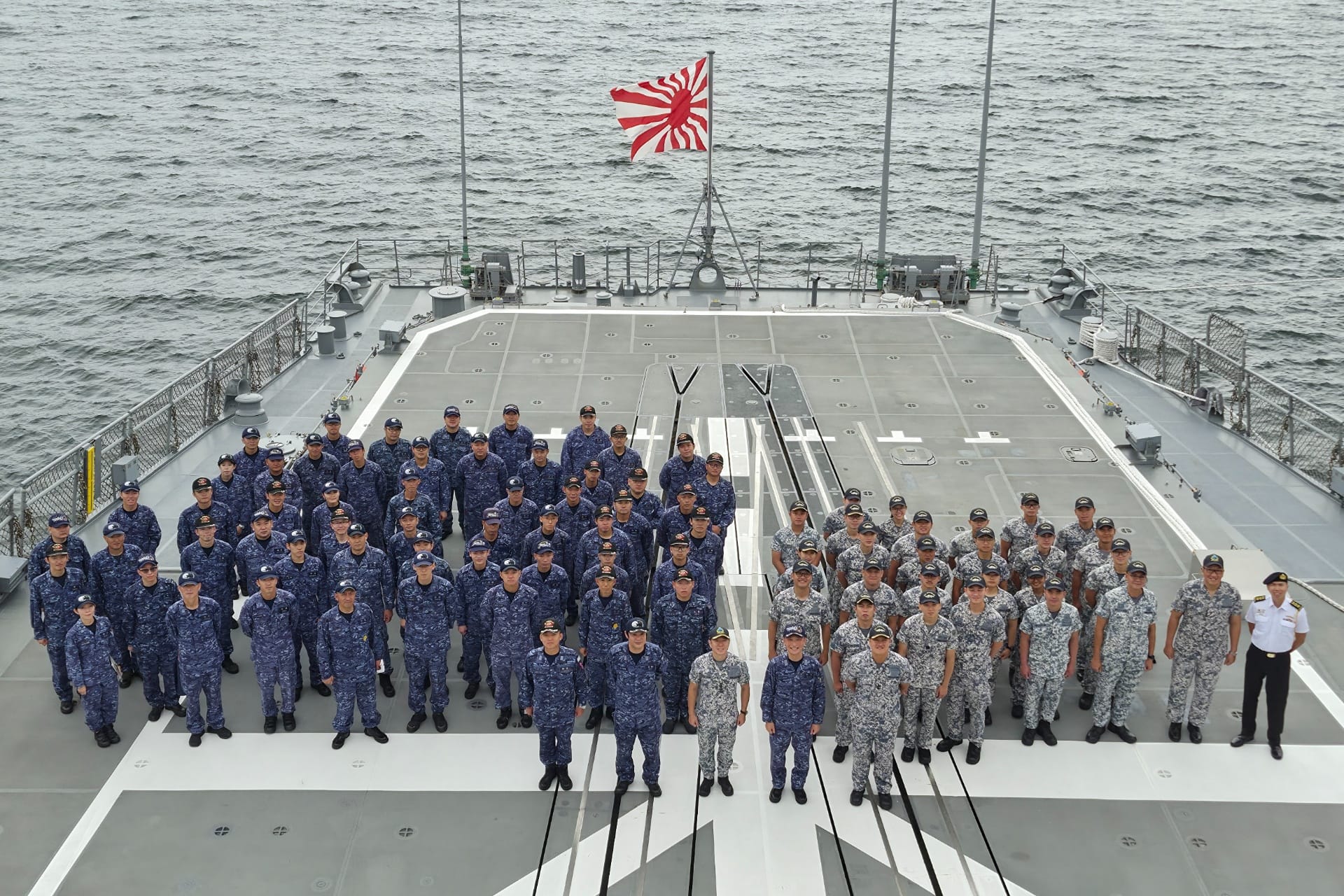 Personnel from the RSN and the JMSDF at the opening ceremony of Exercise Singapan.