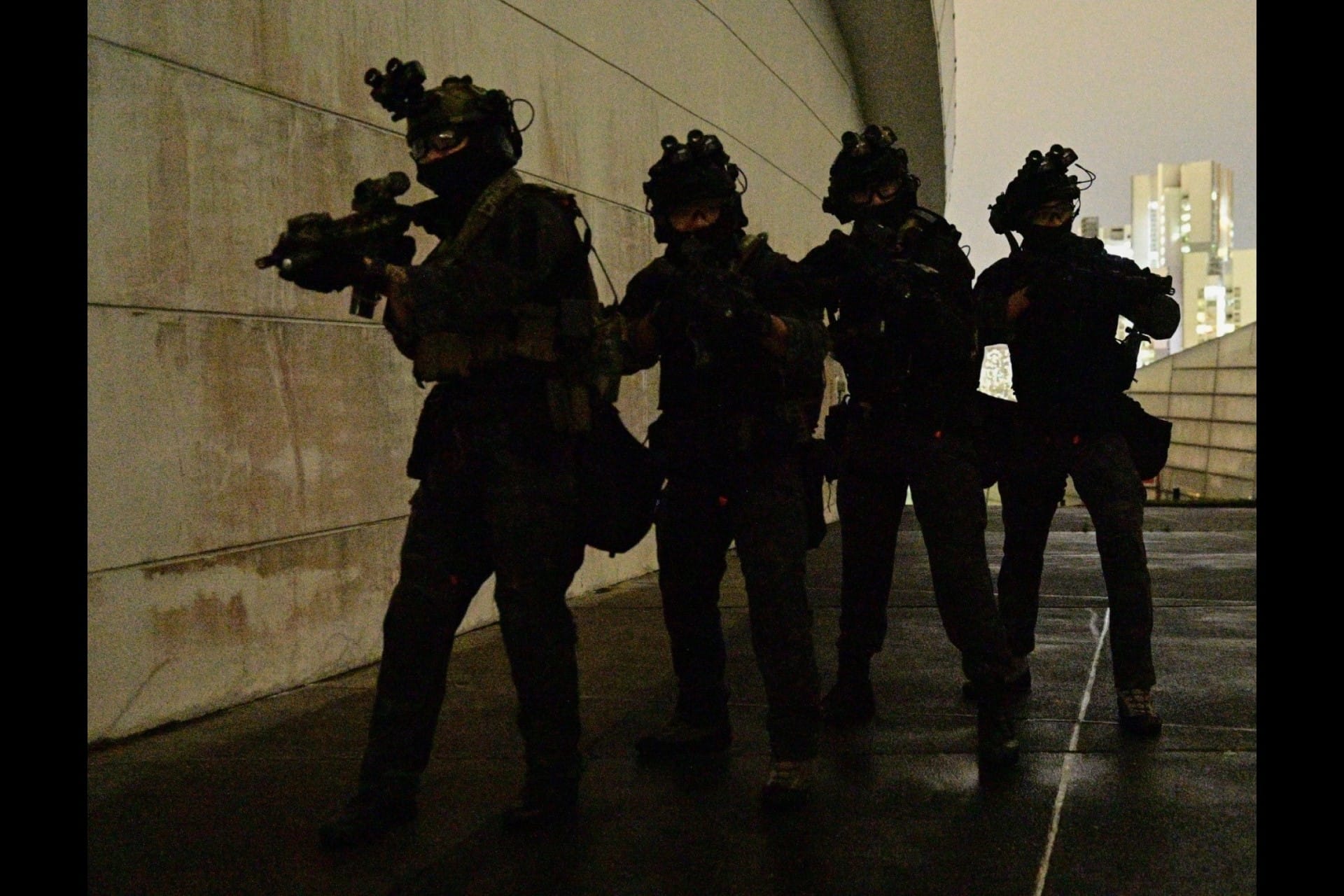 Operators from the Singapore Armed Forces' (SAF) Special Operations Task Force (SOTF) preparing to storm the room during a counter-terrorism exercise conducted by the SAF at The Star Vista yesterday evening.