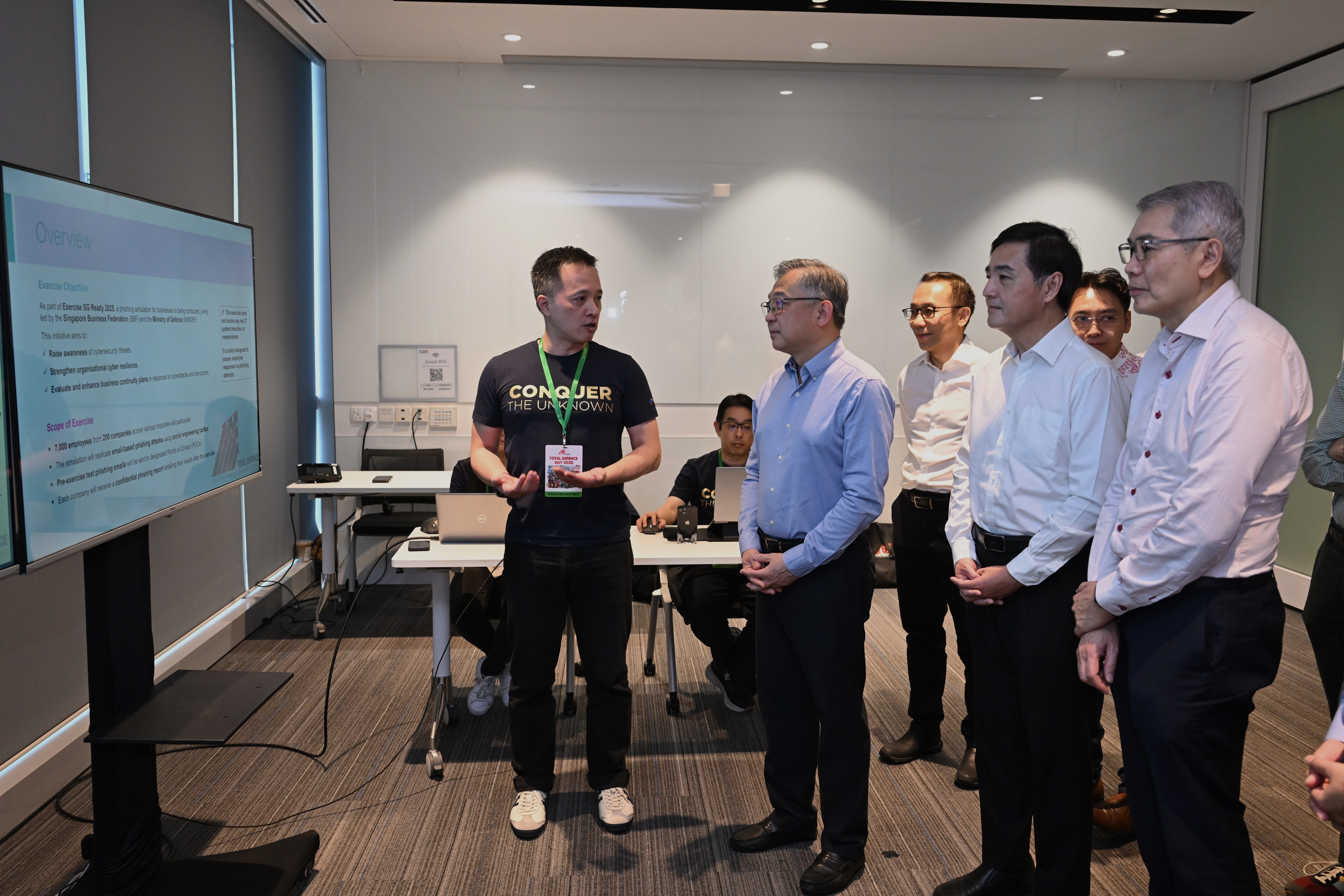 DPM Gan being briefed about a nation-wide phishing drill co-led by Nexus and SBF, for businesses especially small and medium enterprises (SMEs). 