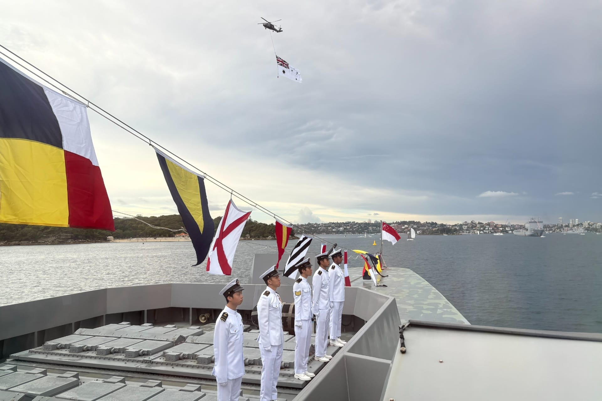 Crew from RSS Intrepid participating in the International Fleet Review during Exercise Kakadu 2026.