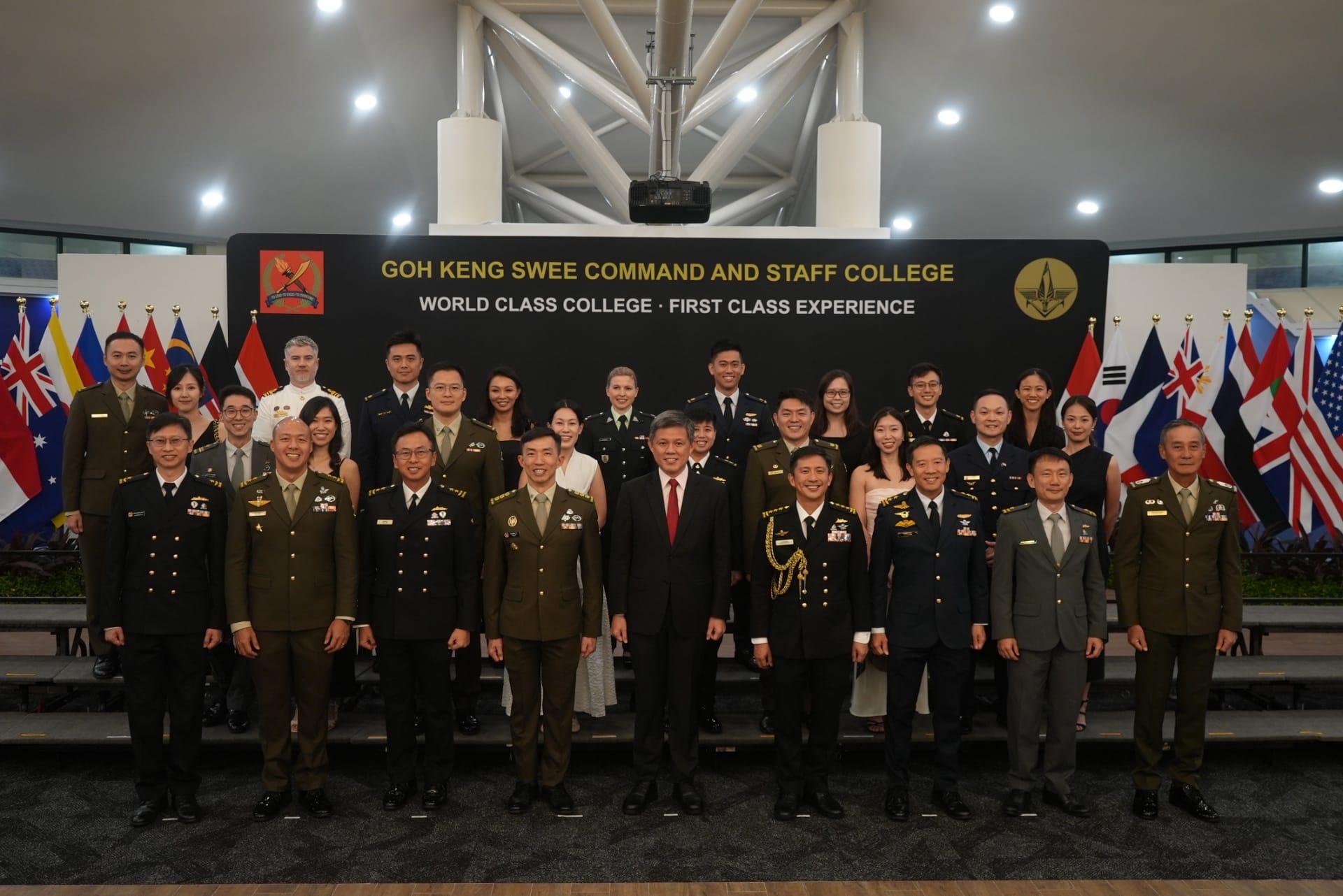 Minister Chan in a group photo with top graduates at the GKS CSC Command and Staff Course 2026 Graduation Ceremony.