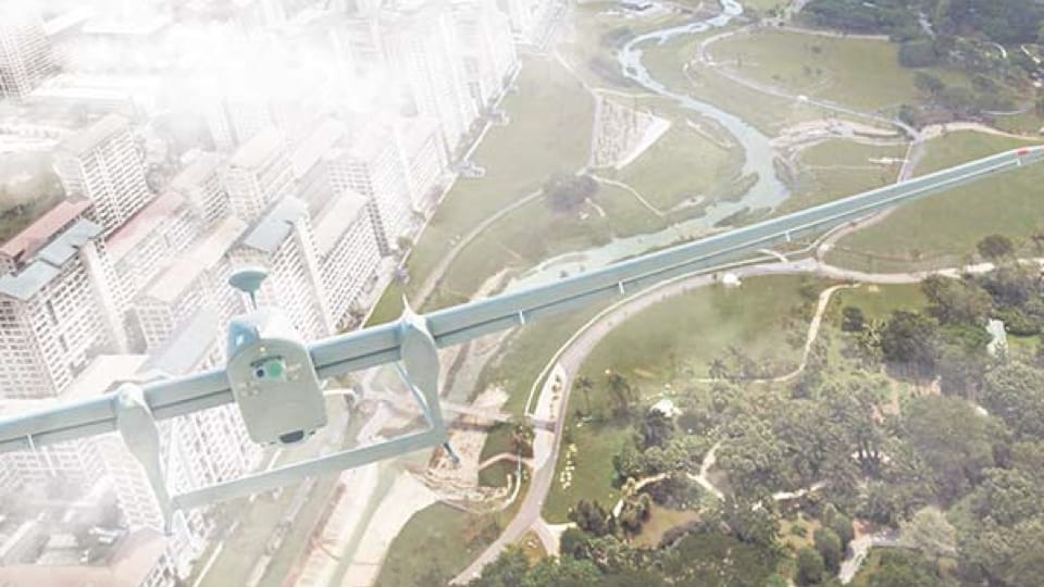 A drone hovering above Singapore's landscape with HDB buildings in the distance.