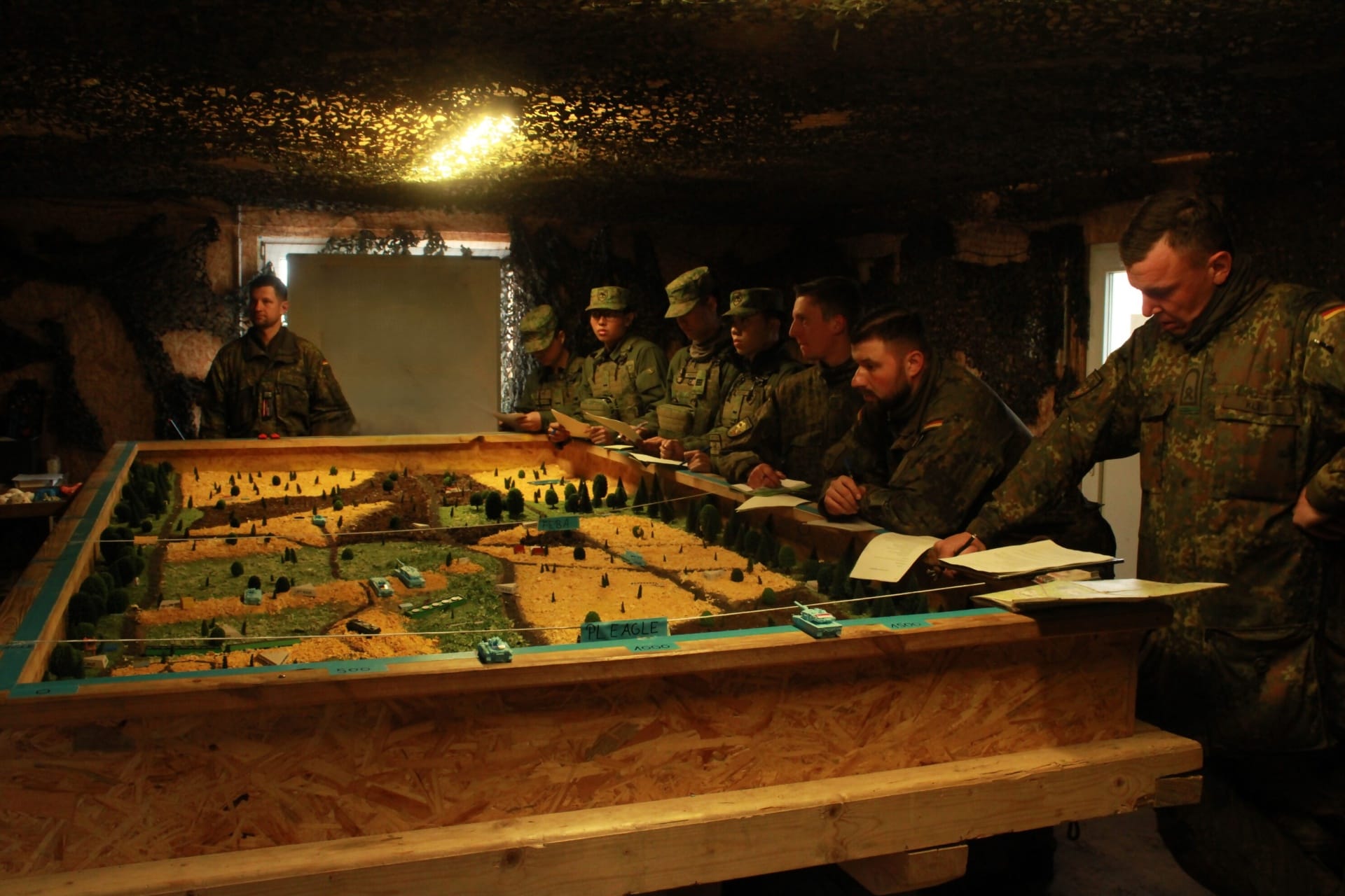 Servicemen from the SAF and the German Armed Forces in a mission brief during Exercise Panzer Strike.