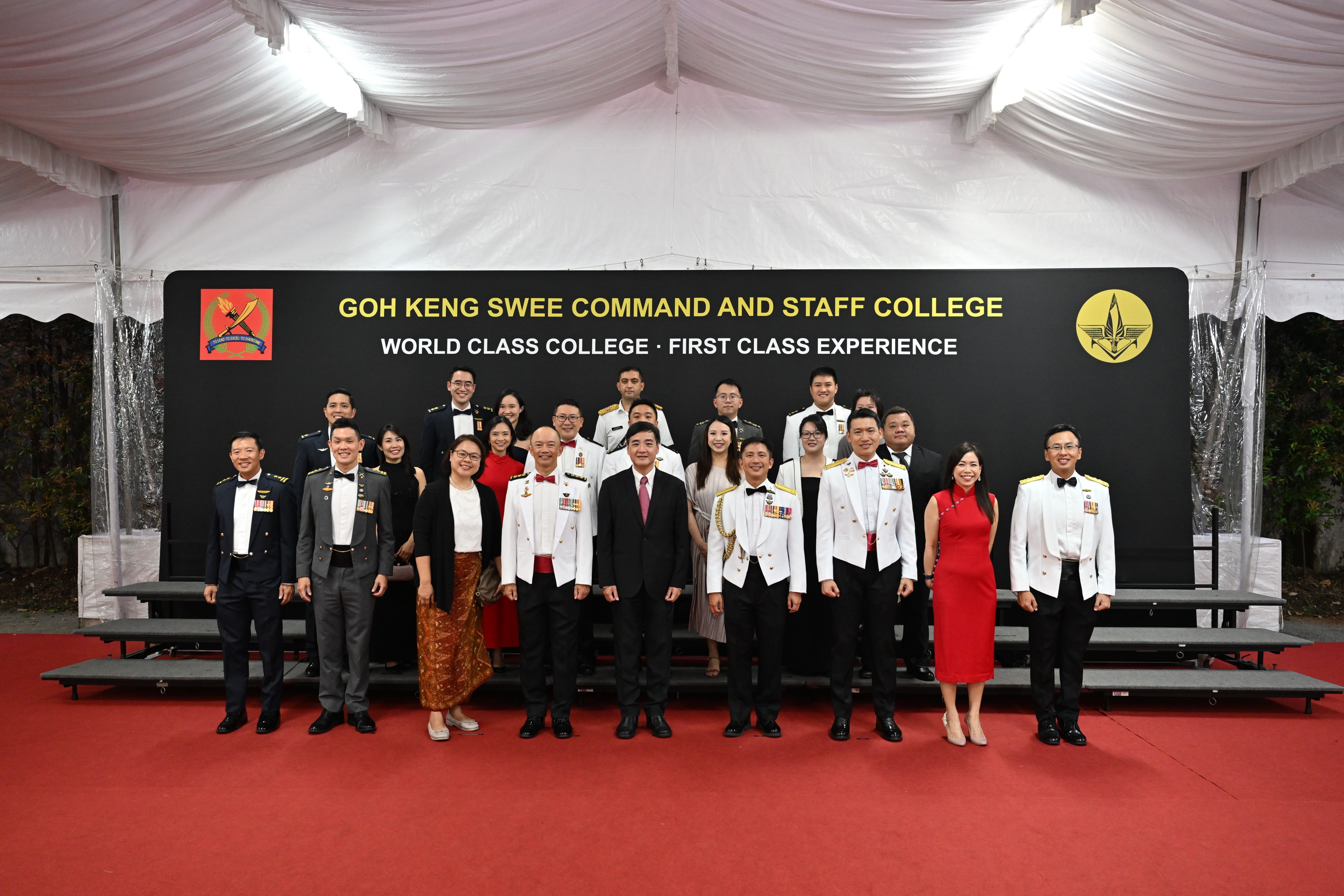 Mr Heng in a group photo with top graduates.