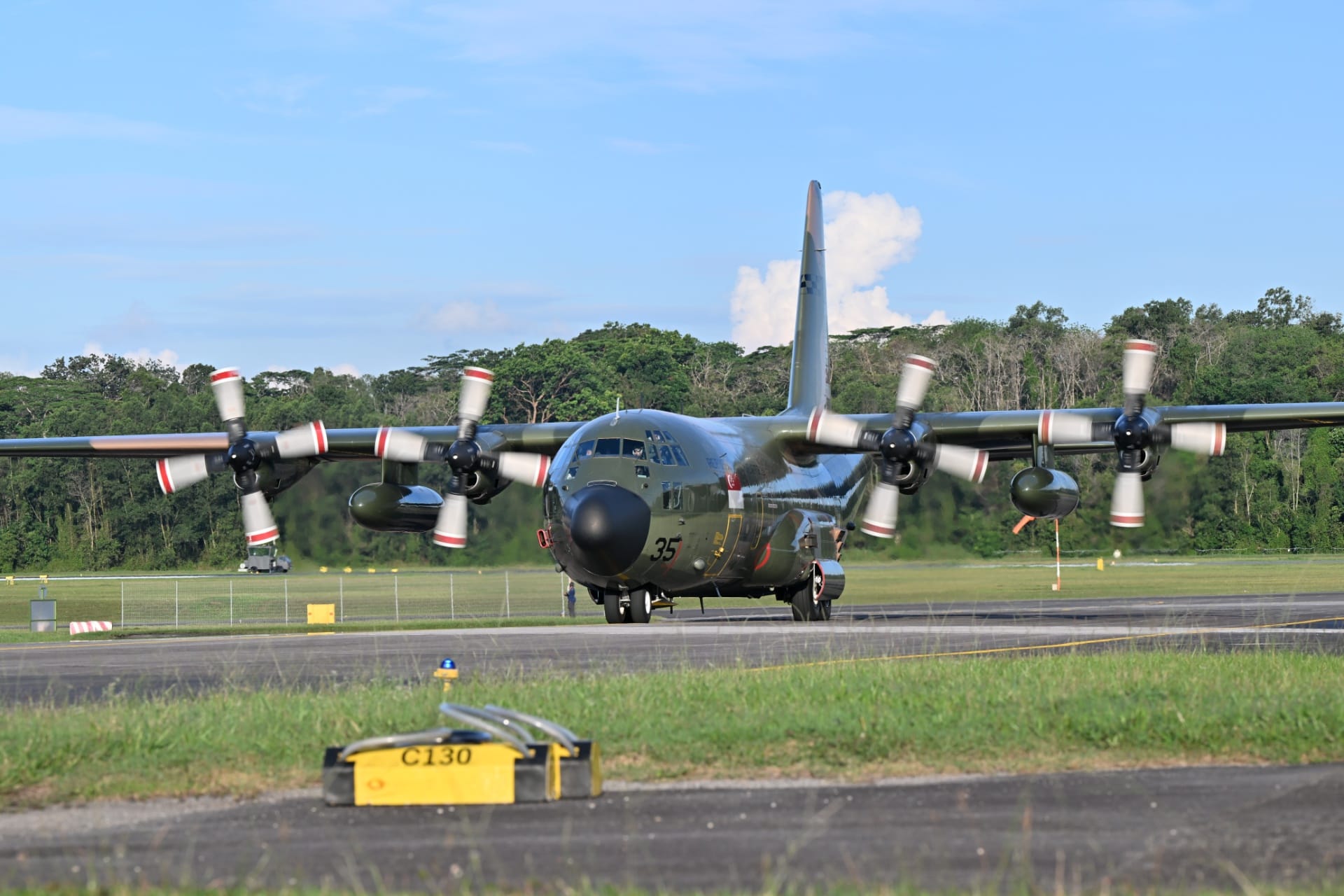 The RSAF’s C-130 transport aircraft arriving back in Paya Lebar Airbase earlier this evening.
