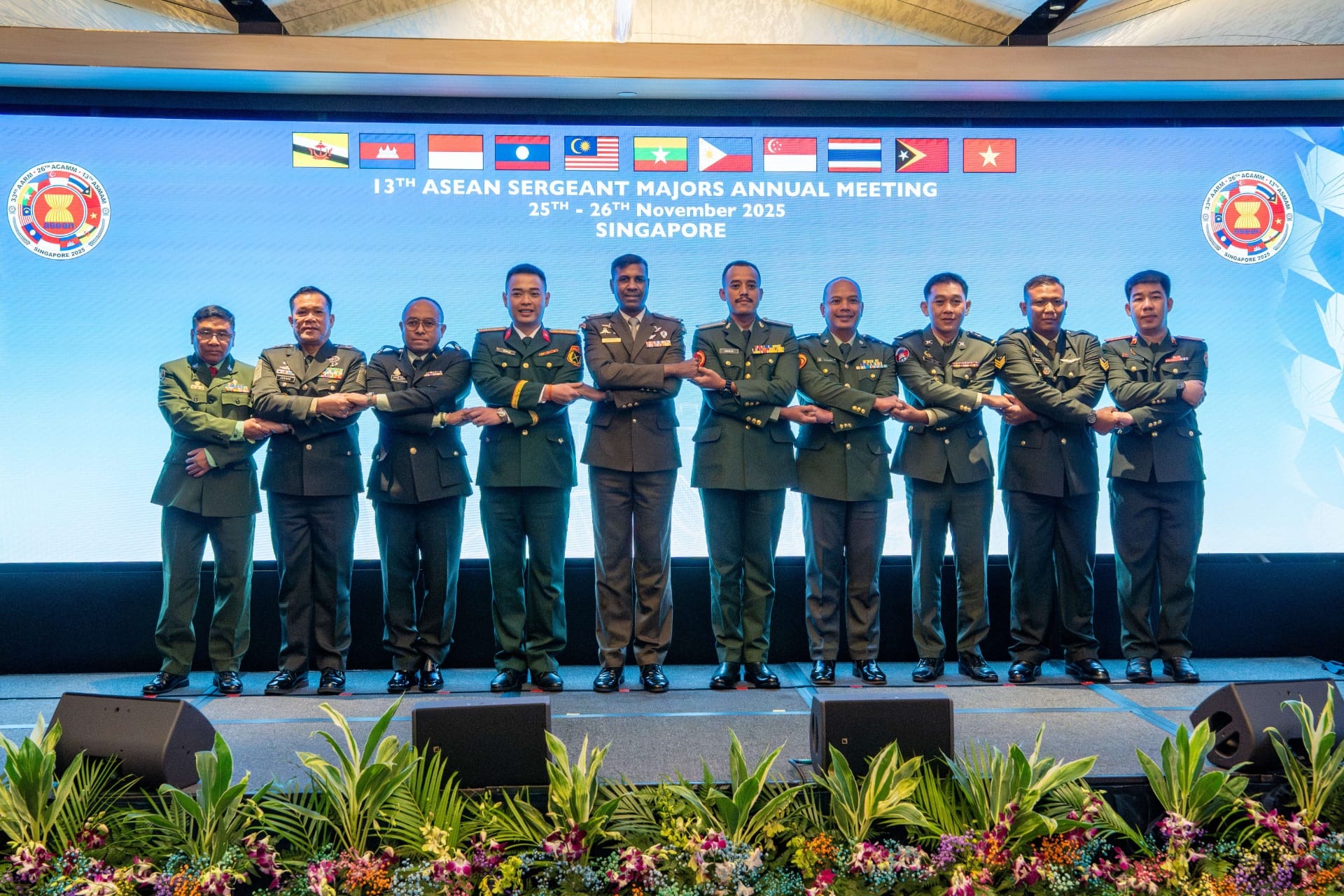 CWO Sanjee (fifth from left), taking part in the ASEAN handshake with the other ASEAN SMAs at the ASMAM.