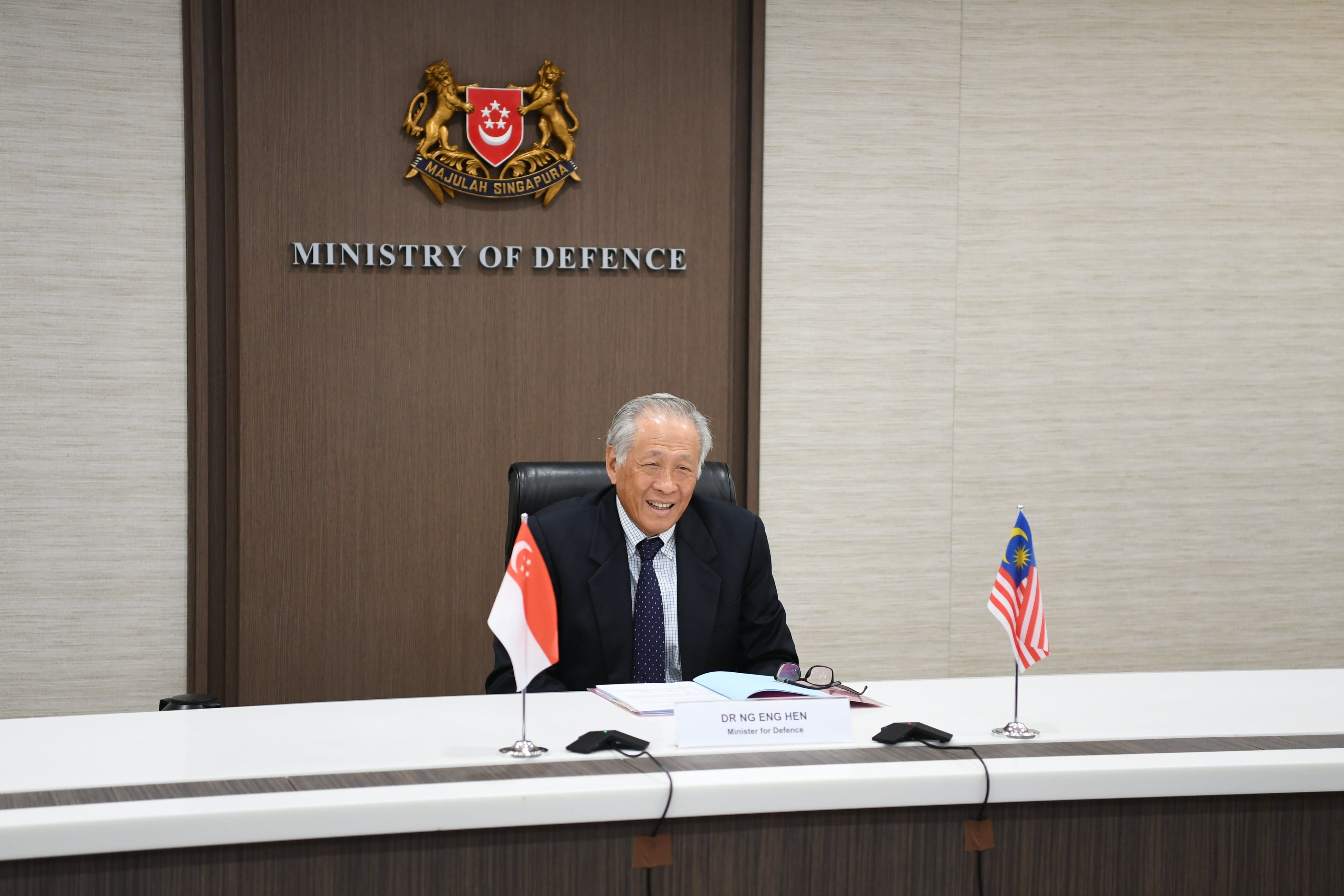 Minister for Defence Dr Ng Eng Hen speaking with Malaysian Senior Minister (Security Cluster) and Minister of Defence Ismail Sabri Yaakob during a bilateral video conference.