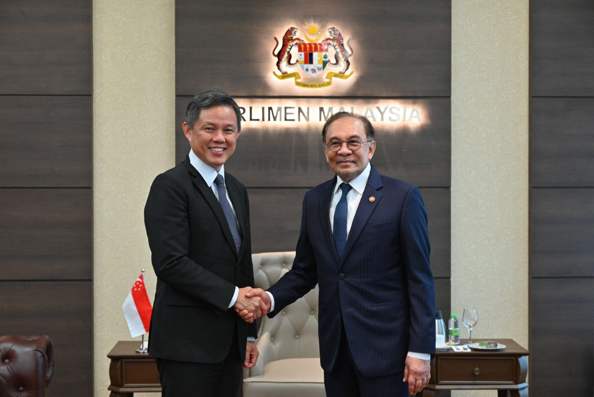 Minister for Defence Mr Chan Chun Sing (left) calling on Malaysian Prime Minister and Minister of Finance Dato' Seri Anw