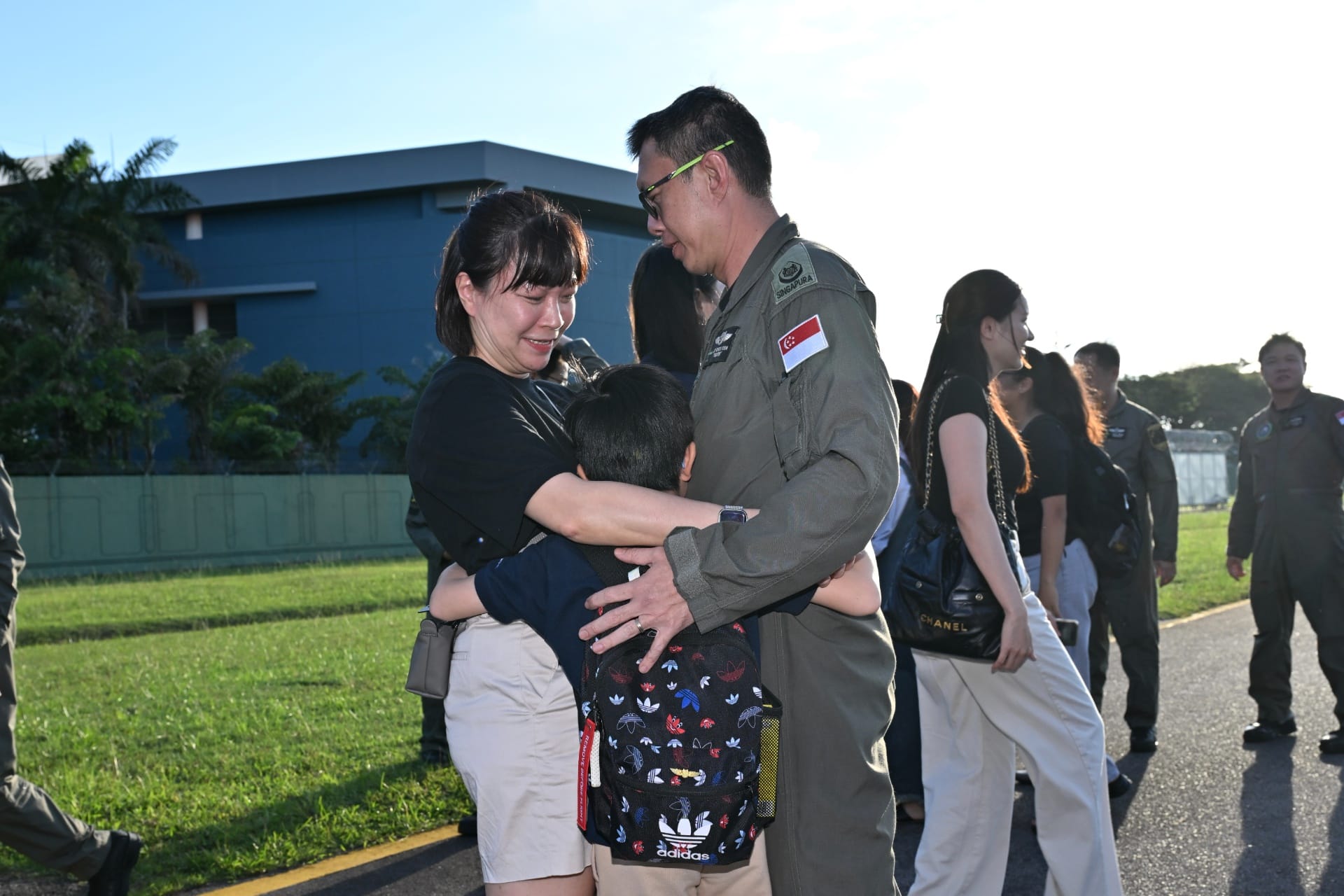 RSAF mission crew meeting his family members upon return to Singapore.