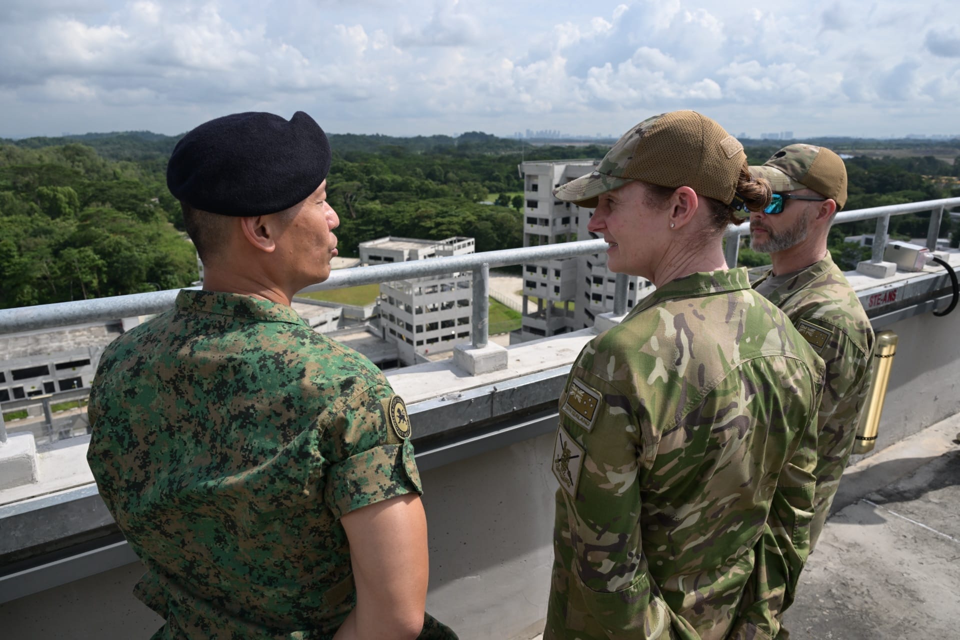 MG King receiving a brief on the urban training facility at SAFTI City.