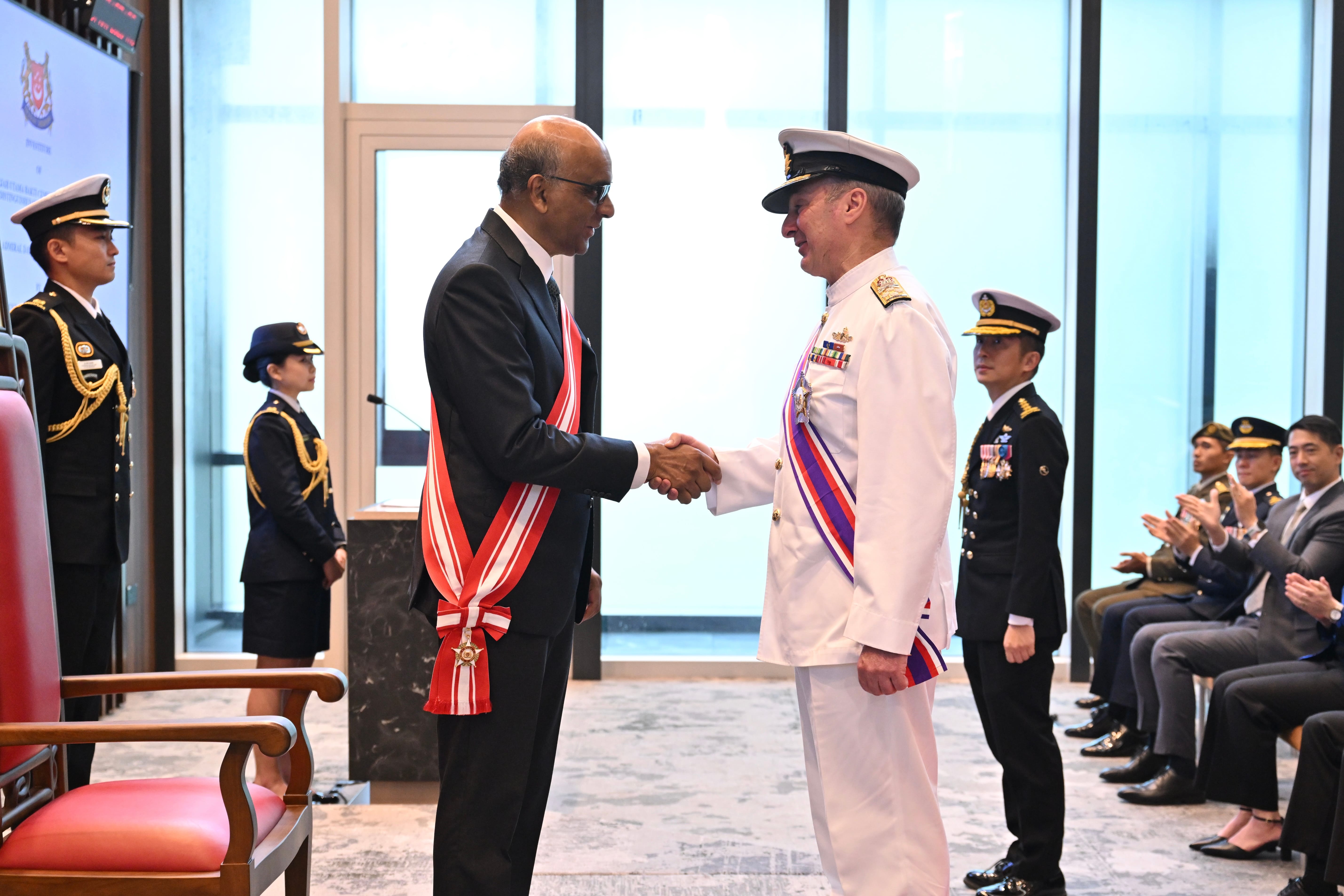 Admiral (ADML) David Johnston (right) with President Tharman Shanmugaratnam (left) after receiving the Distinguished Service Order (Military) award at the Ministry of Defence.