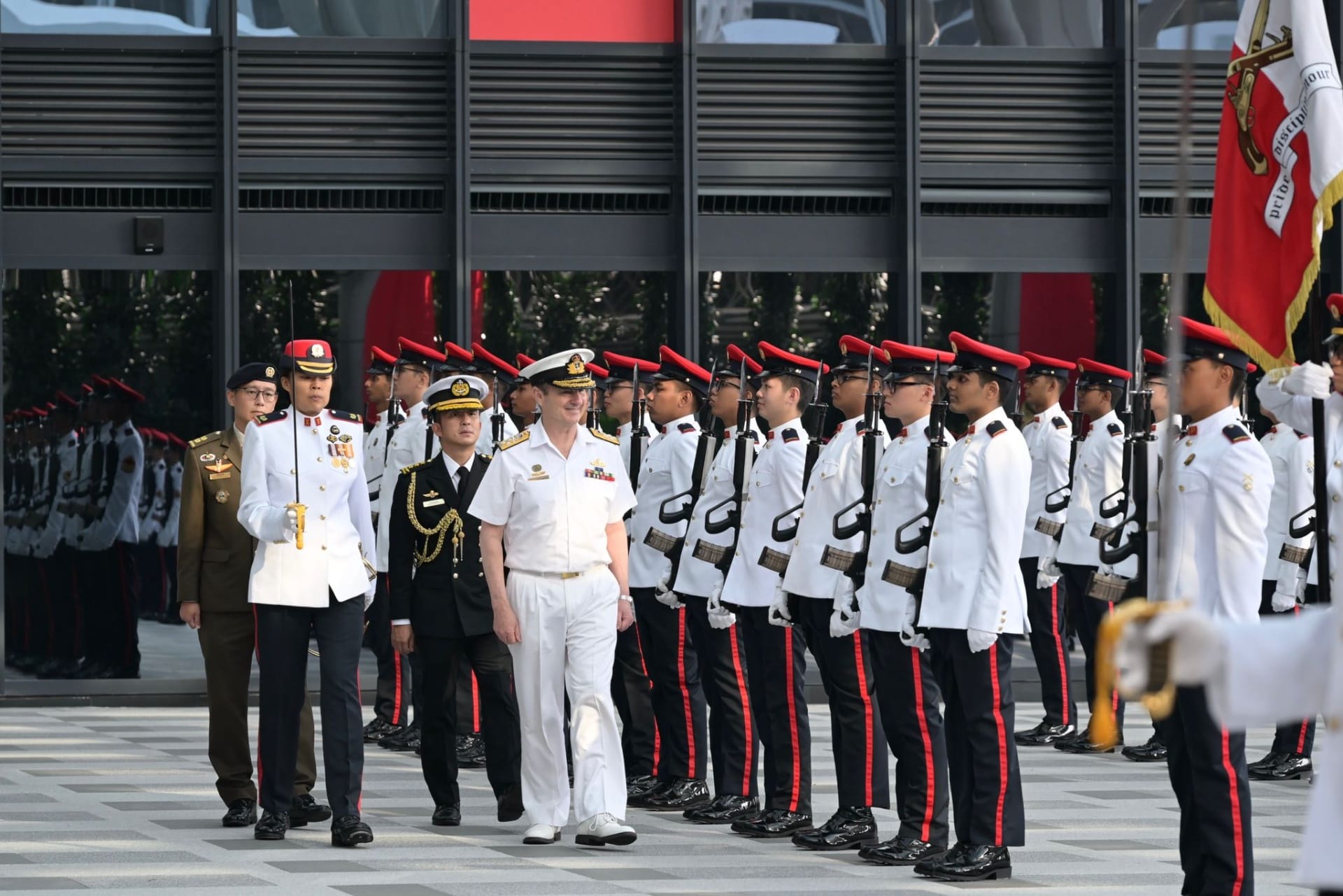 ADML Johnston inspecting the Guard of Honour at MINDEF