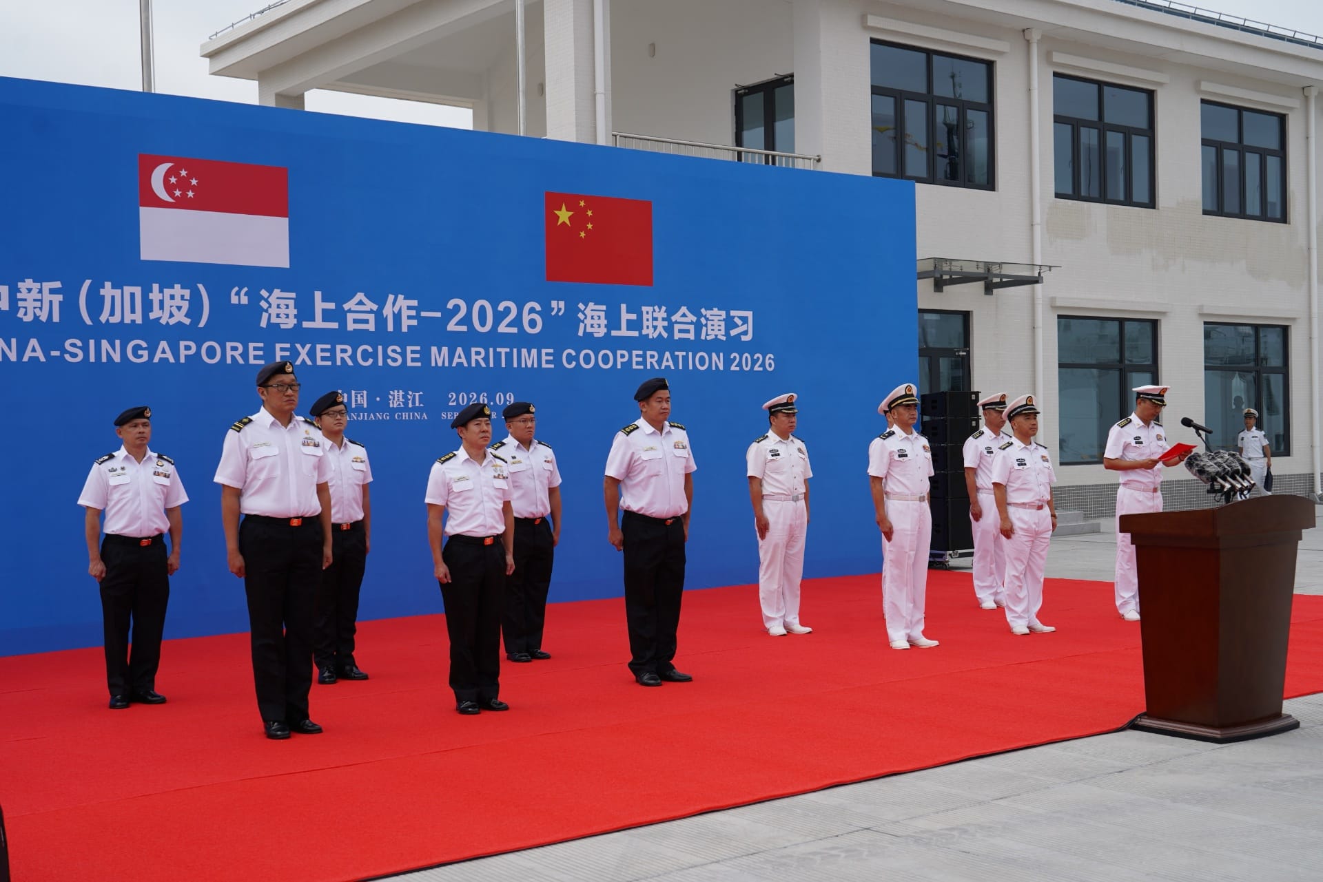 Deputy Fleet Commander of the Republic of Singapore Navy, Colonel (COL) Ng Yen Meng (front row, third from left) and People's Liberation Army (Navy) Deputy Chief of Staff of Southern Theatre Command Navy, Rear Admiral Xia Ziming (front row, third from right) co-officiated the Opening Ceremony of Exercise Maritime Cooperation (XMC) 2026.