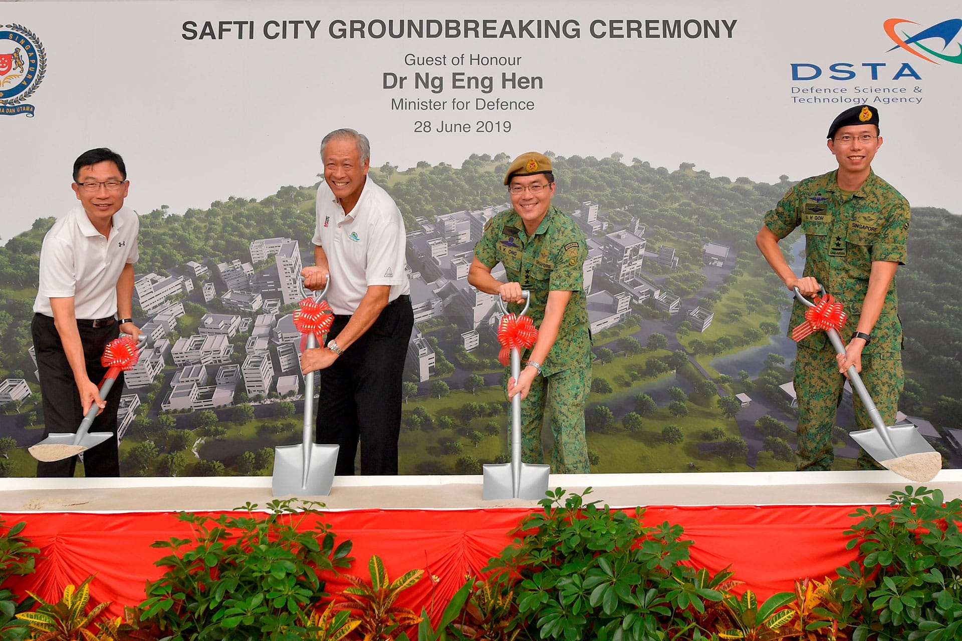 Minister for Defence Dr Ng Eng Hen (second from left) participating in the symbolic sod-turning at the SAFTI City Groundbreaking Ceremony with Chief Executive of the Defence Science and Technology Agency Mr Tan Peng Yam, Chief of Defence Force Lieutenant-General Melvyn Ong, and Chief of Army Major-General Goh Si Hou.