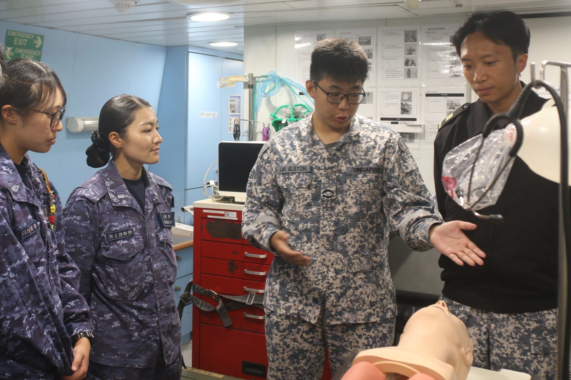 RSN personnel introducing RSS Steadfast’s medical facilities onboard to JMSDF personnel as part of a sea rider exchange.