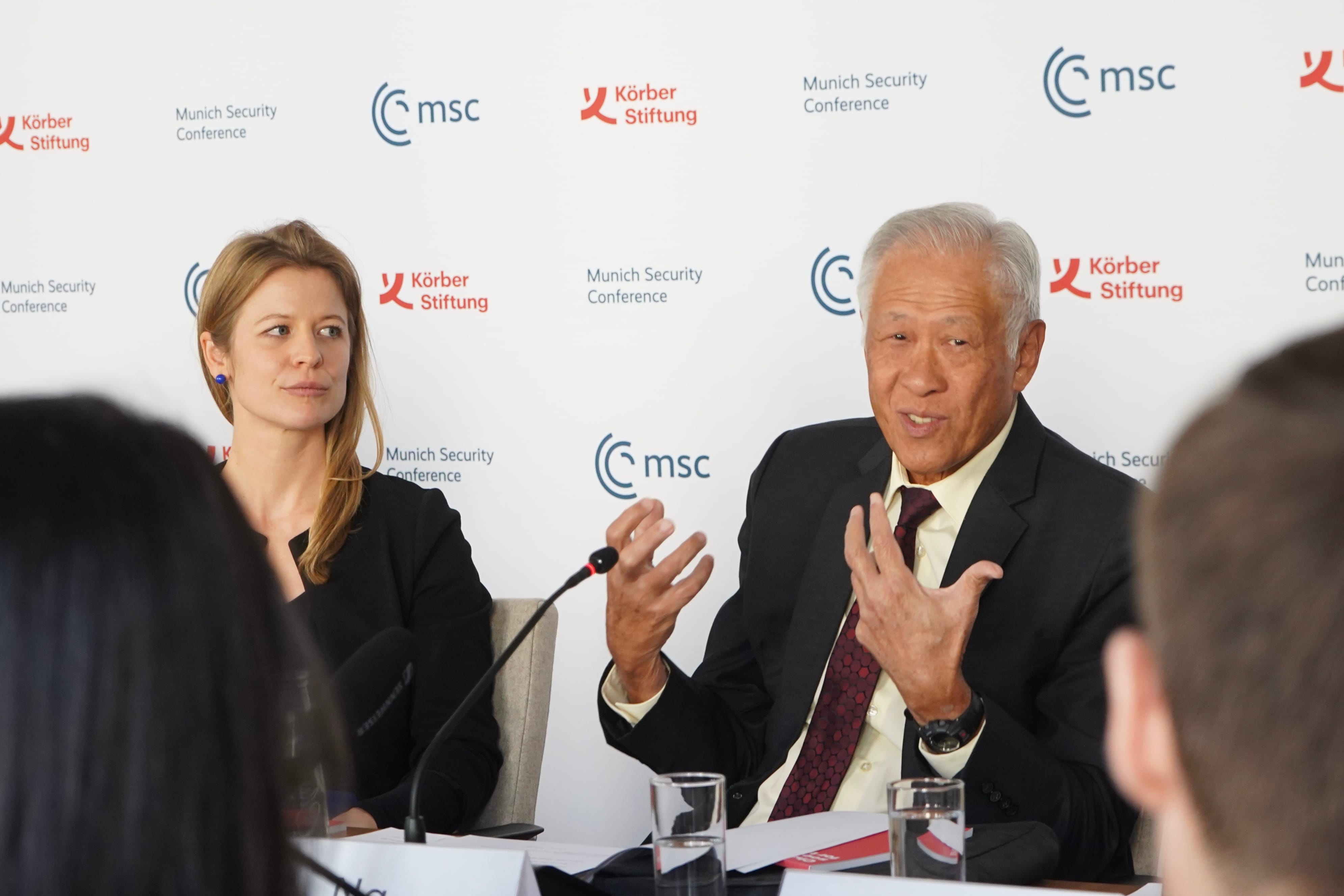 Minister for Defence Dr Ng Eng Hen (right) speaking at the 16th Munich Young Leader's Roundtable.