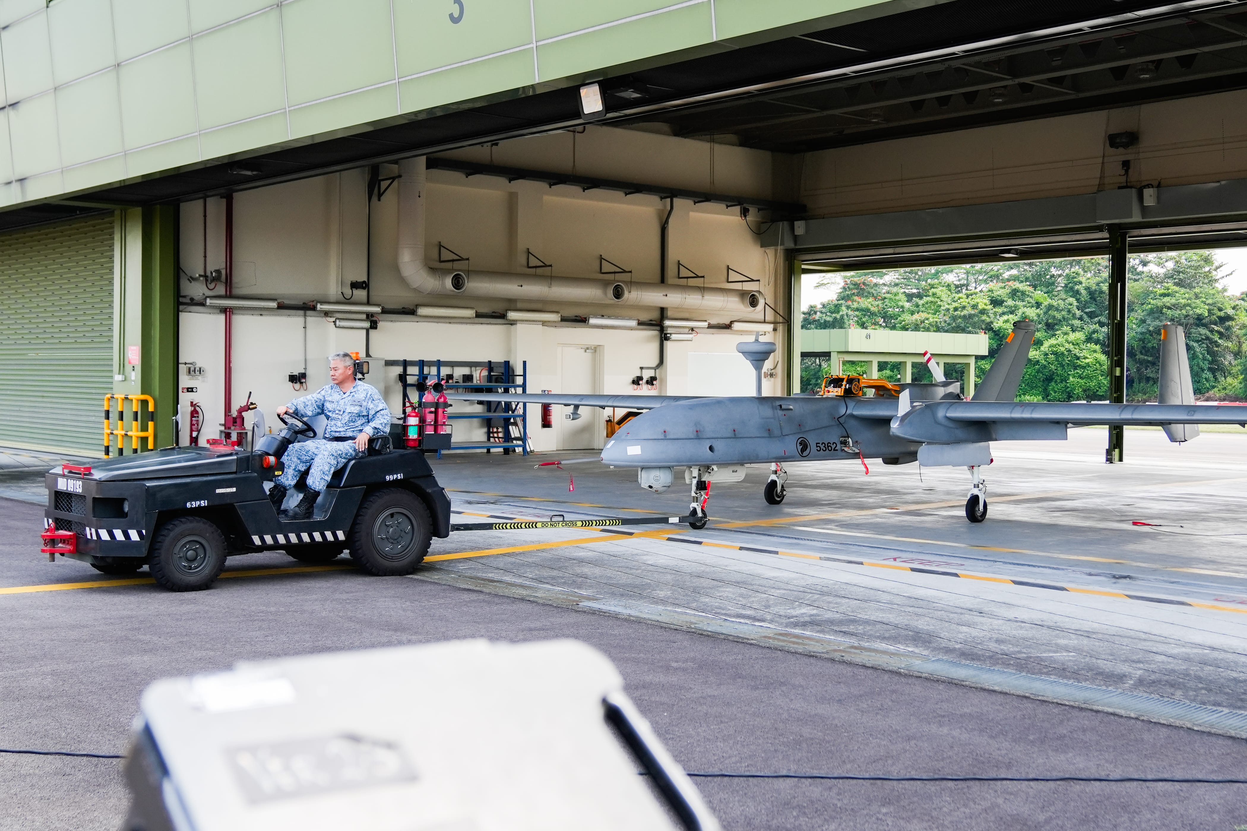 A Heron 1 Unmanned Aerial Vehicle (UAV) is towed out as part of the readiness activities during the recall exercise. 