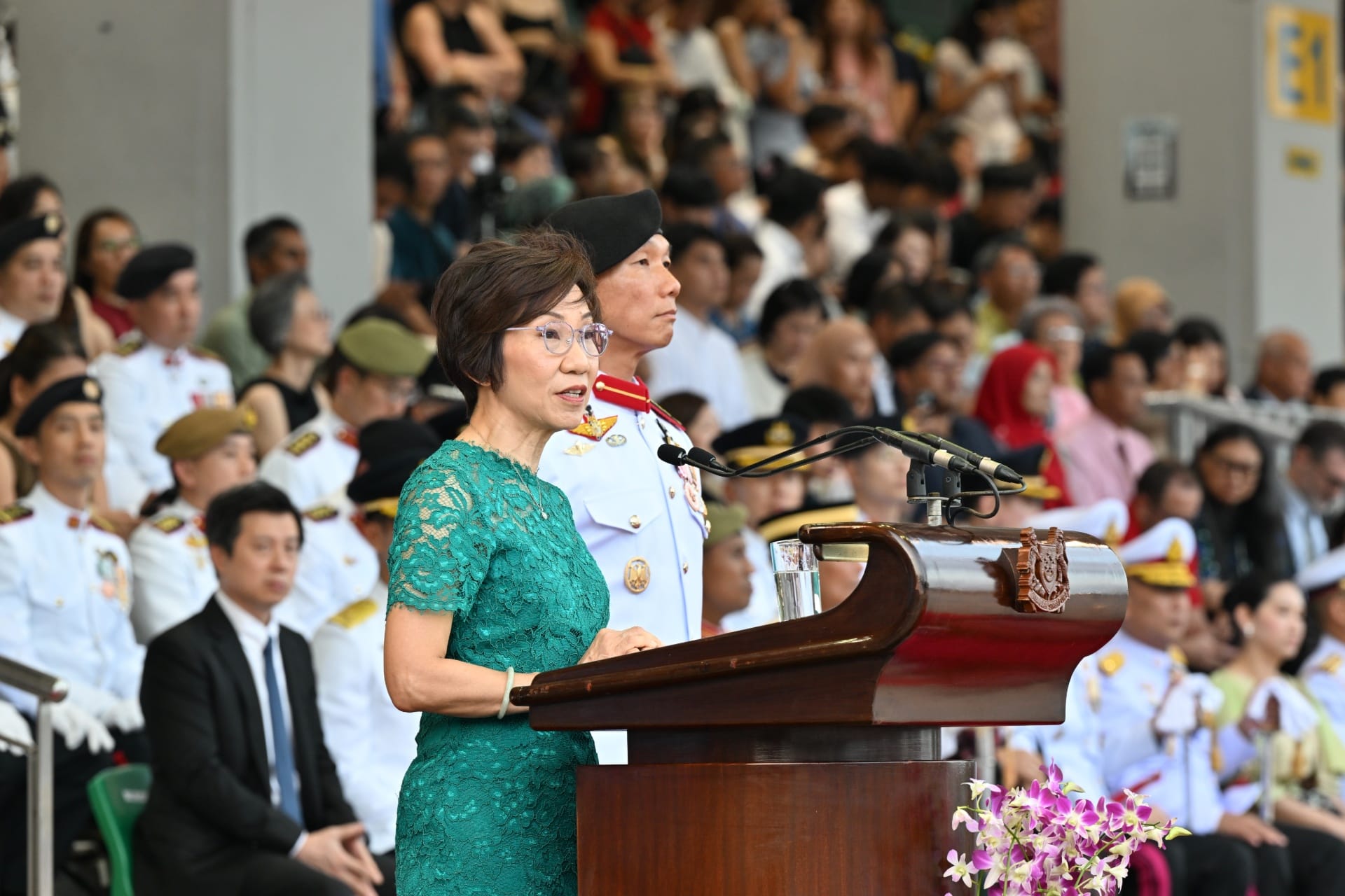 Ms Grace Fu delivering her speech at the parade.